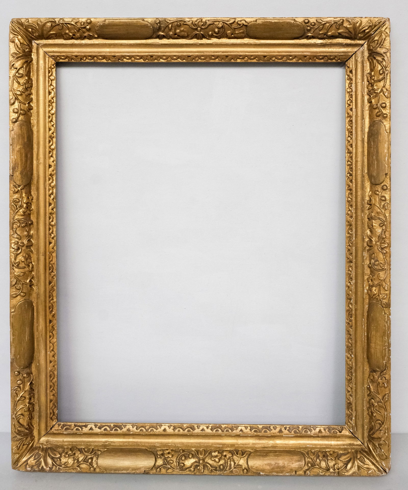 English Lely Giltwood Frame 23" x 29": English, 18th century, hand carved and gilded in the style favored by Sir Peter Lely. Overall 29 1/2" x 35", rabbet 23" x 29", 3 1/2" molding