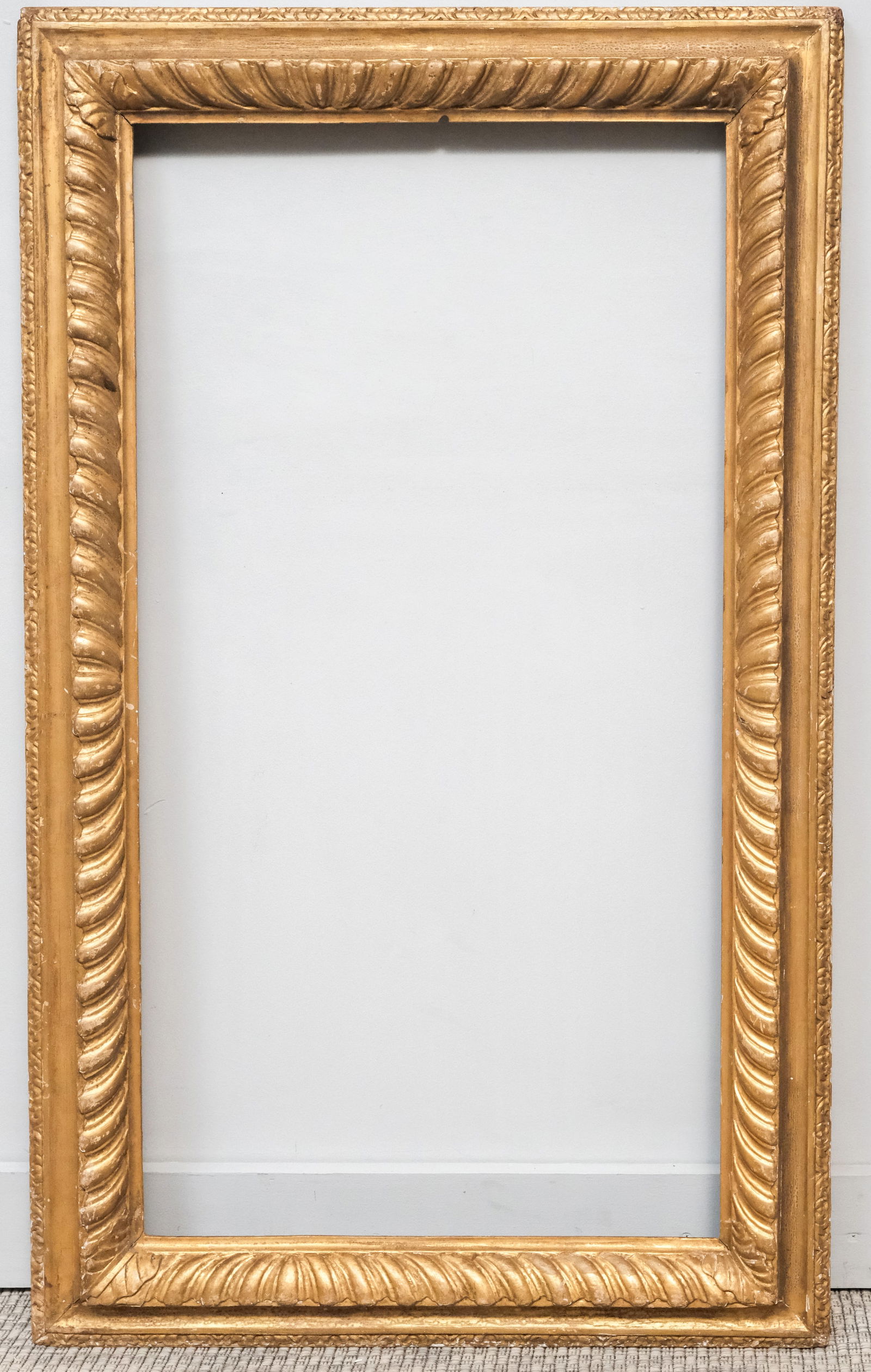 Early English Giltwood Frame 20 1/2" x 38 1/2": English, 18th century, carved and gilded having gadrooning. Overall 27 1/2" x 45 1/2", rabbet 20 1/2" x 38 1/2", 4" molding