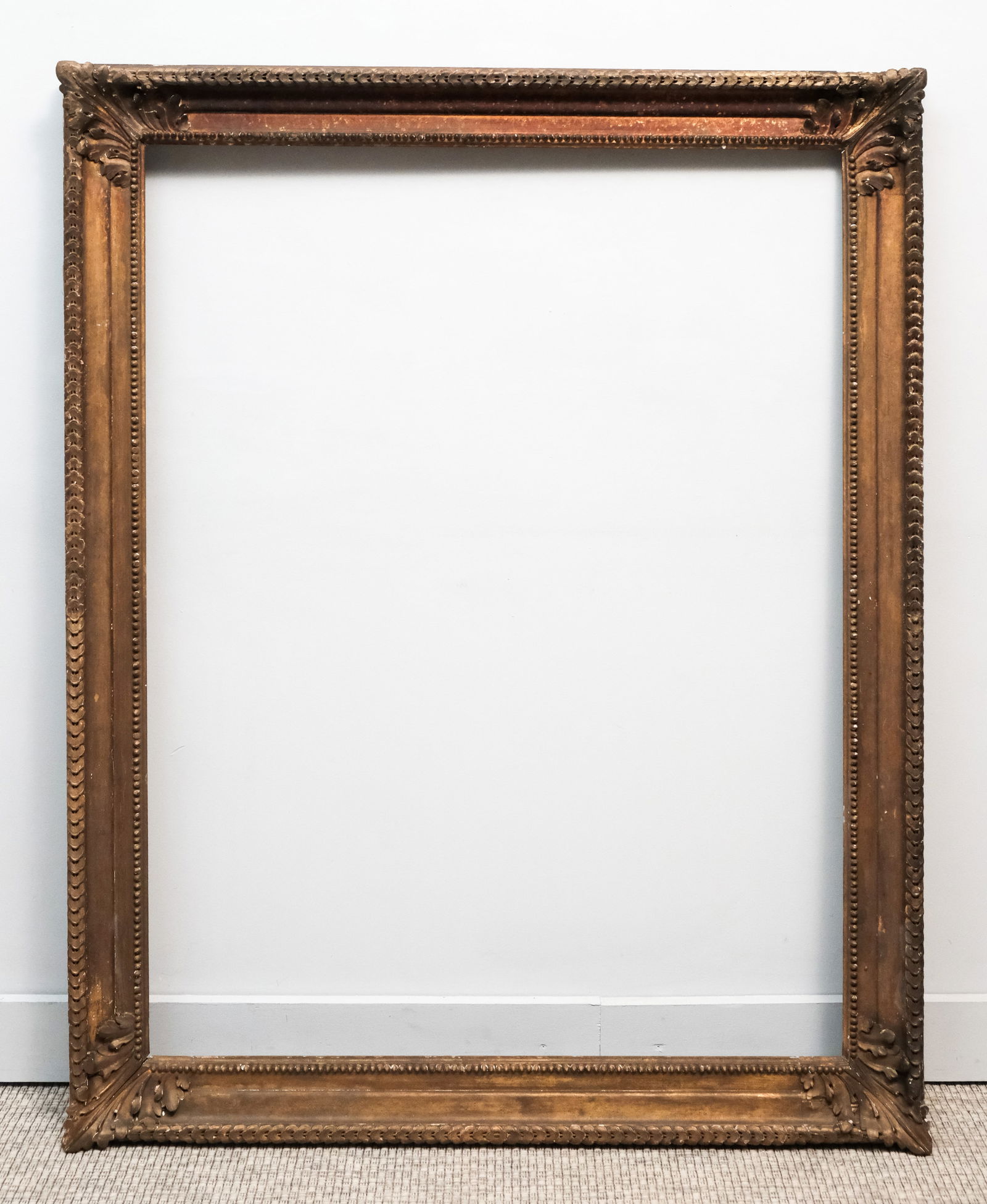 Louis XIV Giltwood Frame 35" x 46": French, 18th century, having guilloche top edge and acanthus corners with ogee profile. Overall 42" x 53", rabbet 35" x 46", 4" molding