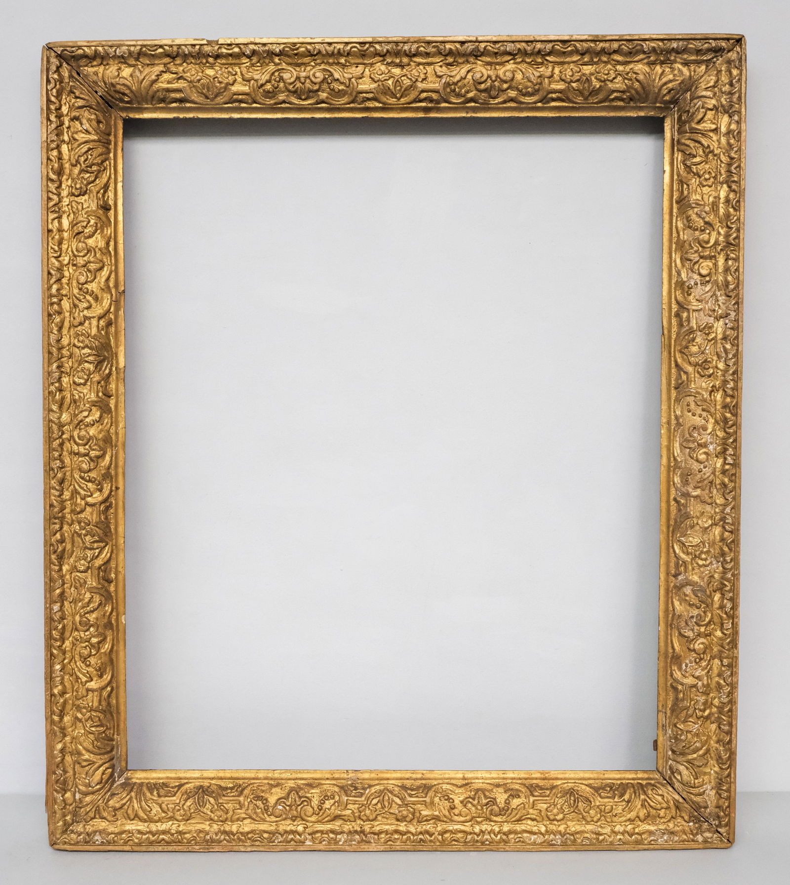 English Giltwood Frame 24 1/2" x 29 3/4: English, 18th century, carved and gilded in the Italian taste. Overall 30 1/2" x 35", rabbet 24 1/2" x 29 3/4", 3" molding