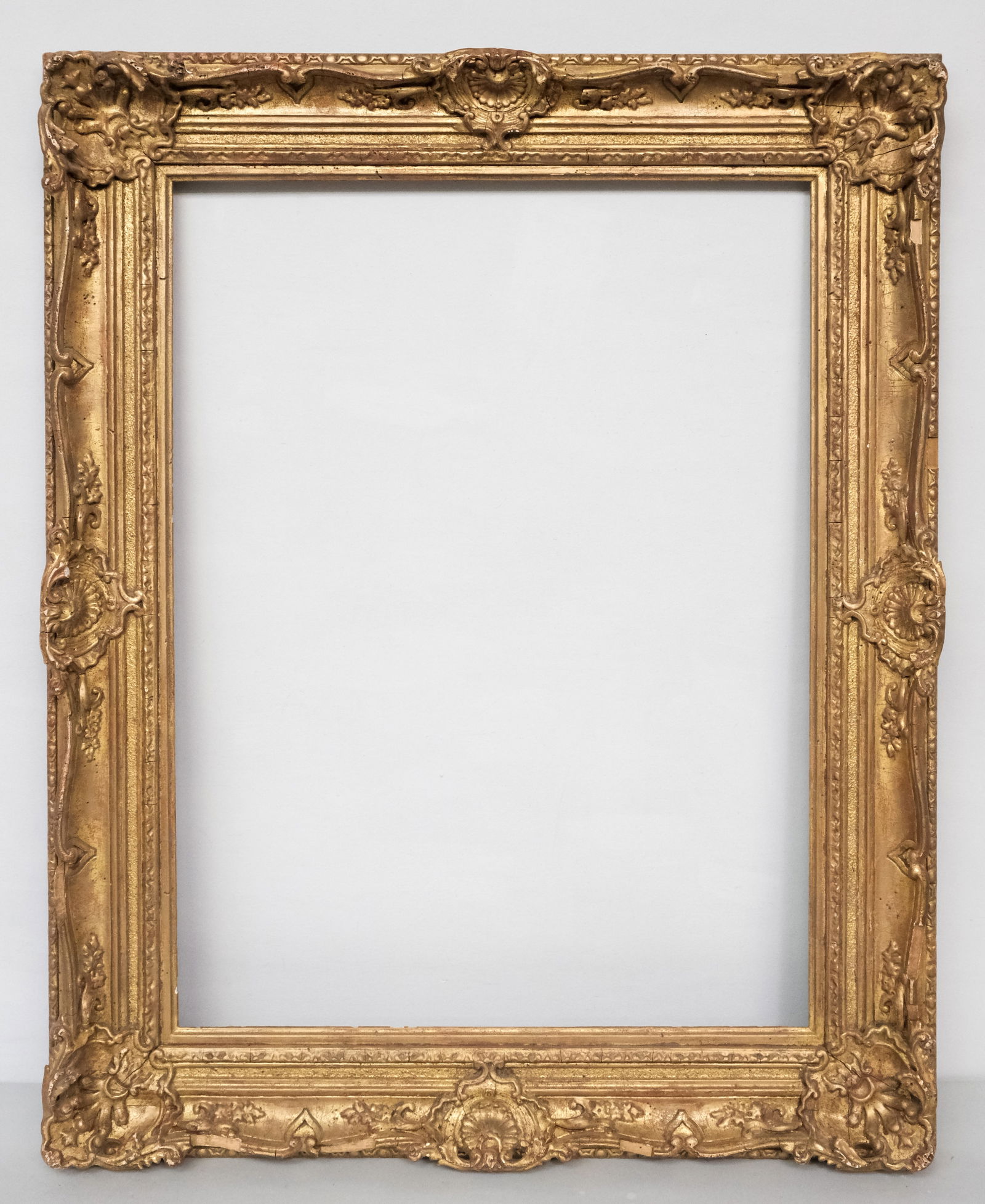 Louis XV Giltwood Frame 21" x 28": American, 20th century, finely gilded in the French taste. Overall 28 3/4" x 35 1/2", rabbet 21" x 28", 4" molding