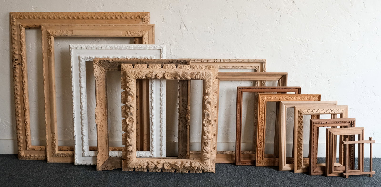 Group of 13 Unfinished Heydenryk Frames: A generous lot! Smallest overall 11" x 13", rabbet 8" x 10", 3/4" molding, largest overall 48 1/4" x 52 1/4", rabbet 38" x 42", 5 1/2" molding