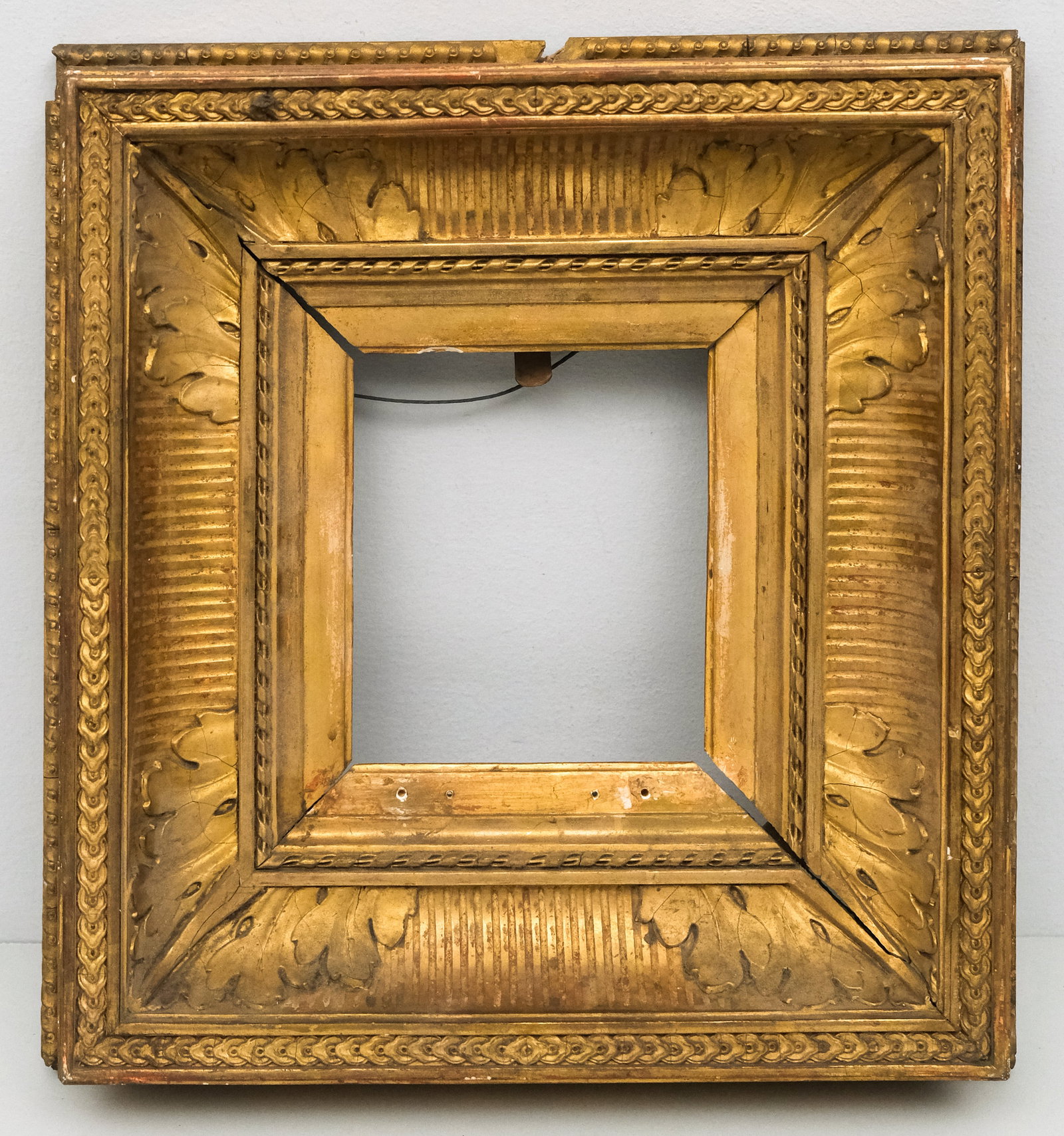 French Neoclassical Fluted Cove Frame 5" x 6": French circa 1850. Having brightly gilded fluted cove with guilloche top edge and acanthus decoration in corners. Overall 13" x 14", Rabbet 5" x 6", Molding 4 1/4".
