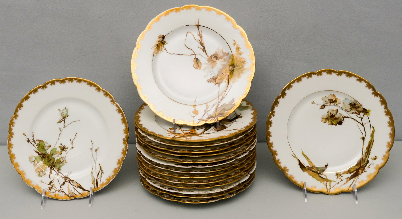 Set of Sixteen Haviland Limoges Porcelain Plates: Brush gilt borders with naturalistic hand painted motifs. Marked as shown. 9 1/2".