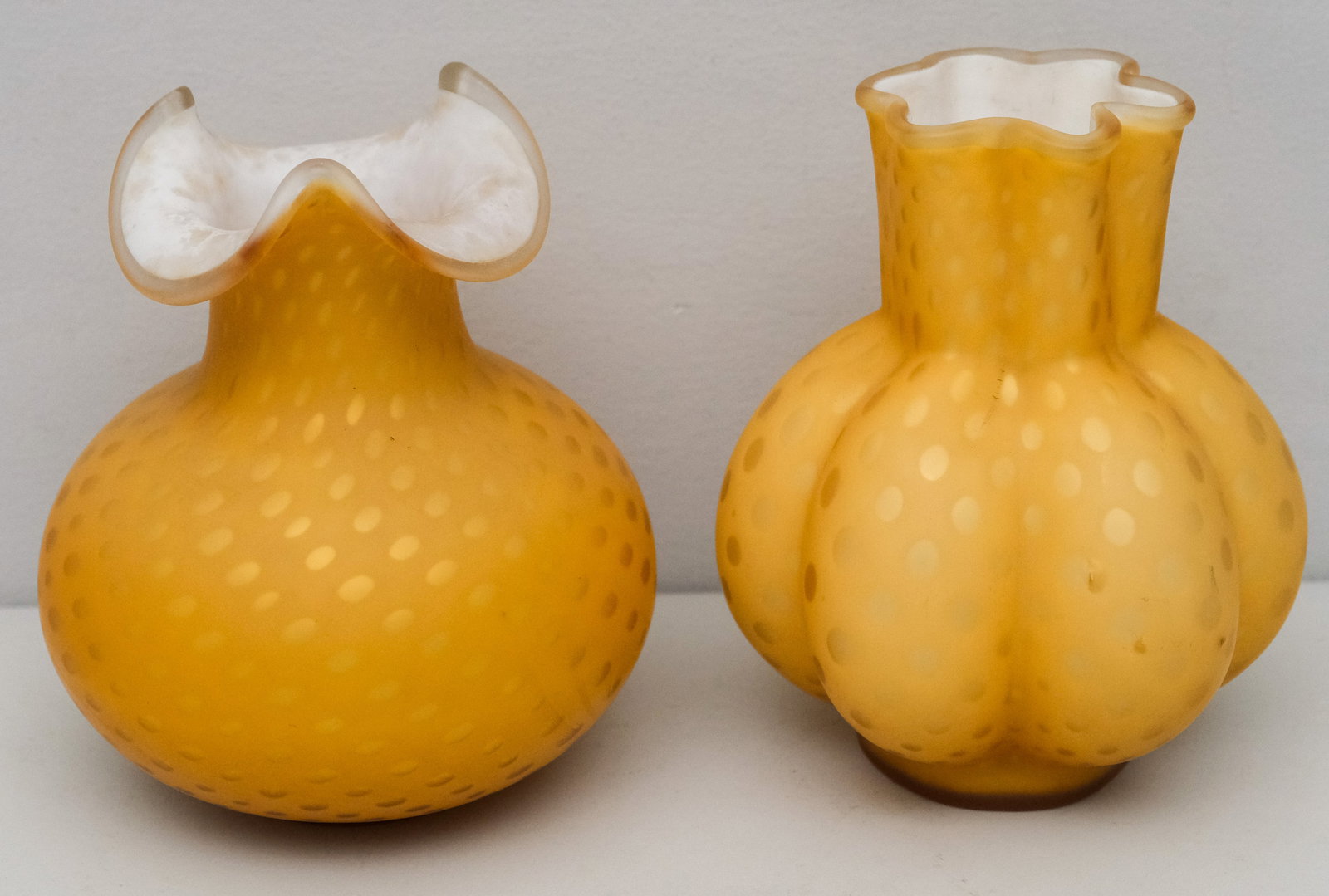 2 Antique Satin Amber Cased Glass Vases: With similar polka internal gold decor. Unmarked. 7 1/2"