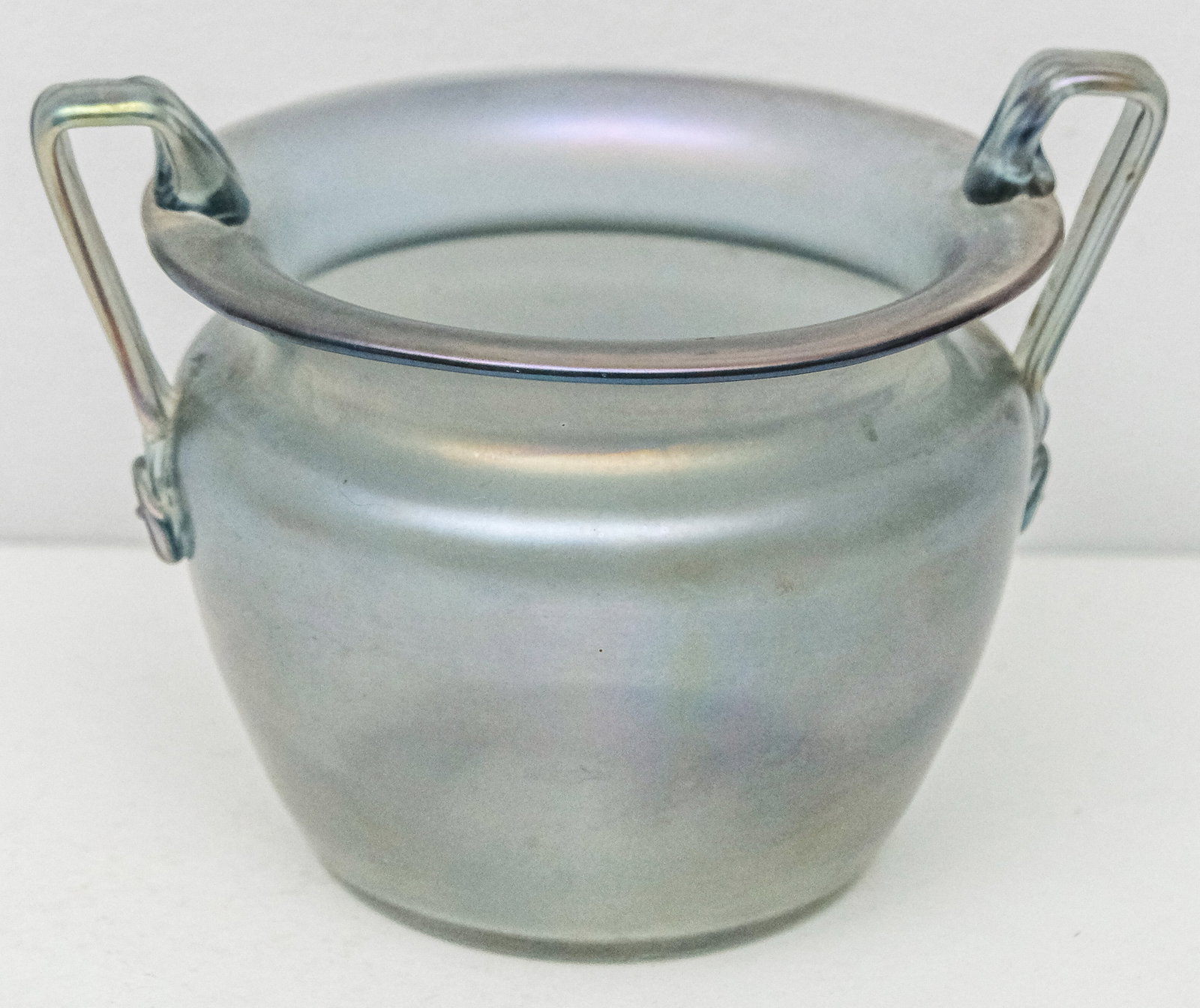 Antique Art Glass Handled Vase: Iridized blue body with applied fluted handles with rosette terminals at body. Wide polished pontil. 6" H x 6" diameter