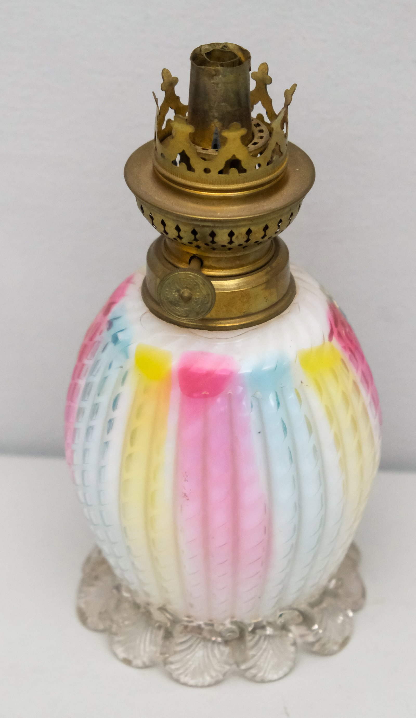 Antique Victorian Rainbow Glass Lamp Base: Likely English, burner marked "S-H". Vertical ribbing with foliate foot. Measures 7 1/2"
