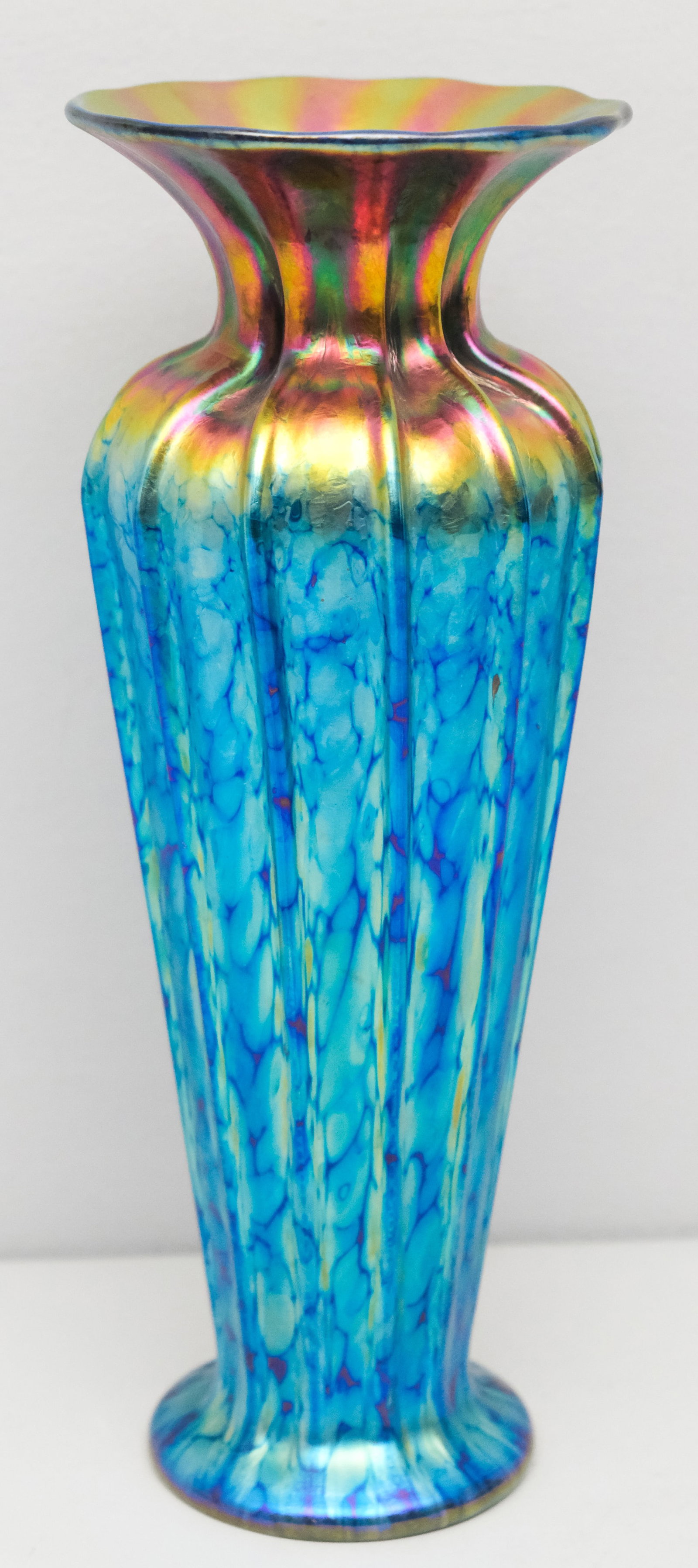 Lundberg Studio Art Glass Sunset Classic Vase: Large ribbed vase in iridescent blue to pink gold. C. 2001. Marked as shown. 12 1/2".