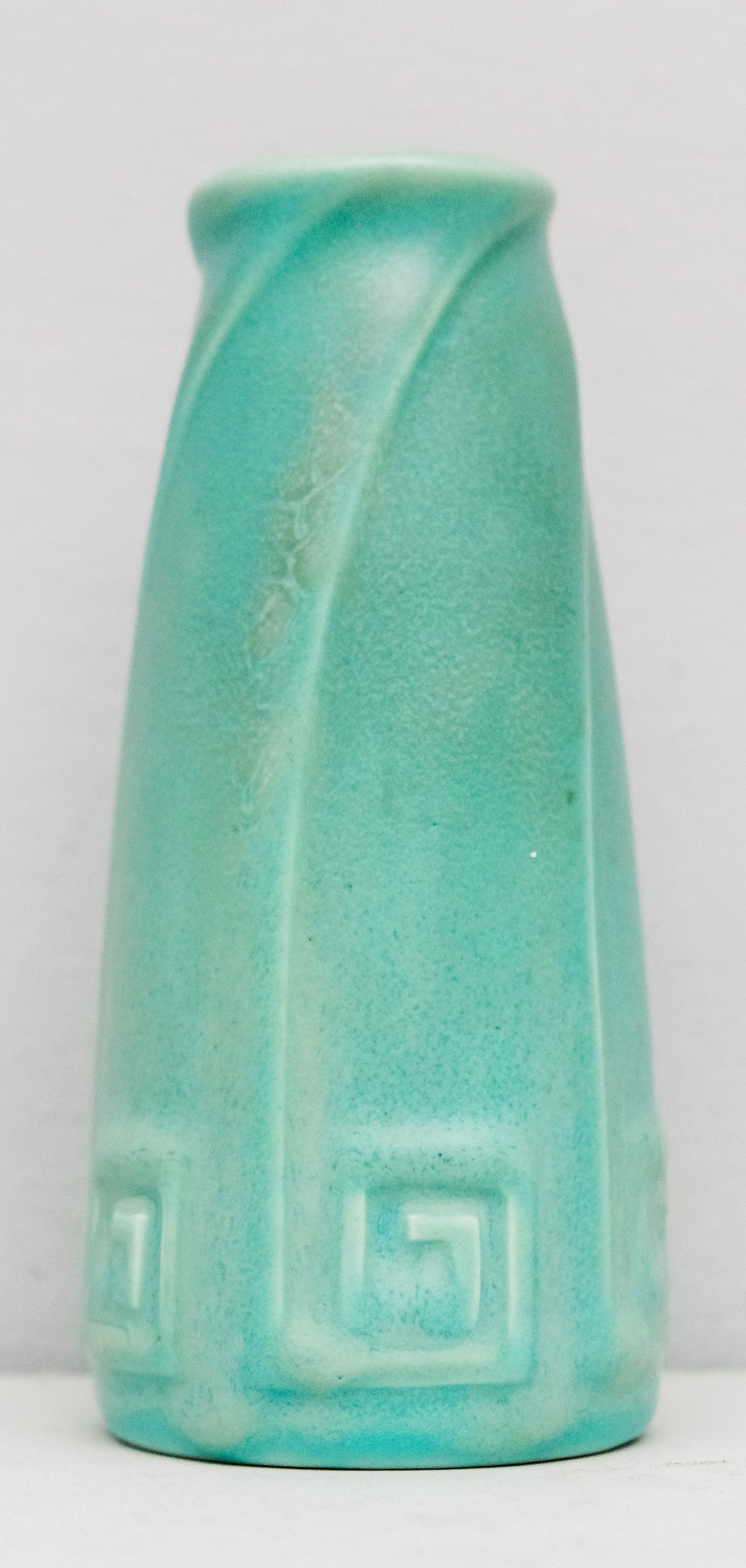 1920 Rookwood Pottery Vase: Raised greek key in sweeping upward swirl. Turquoise matte glaze. Marked as shown. Model 2135. 6"