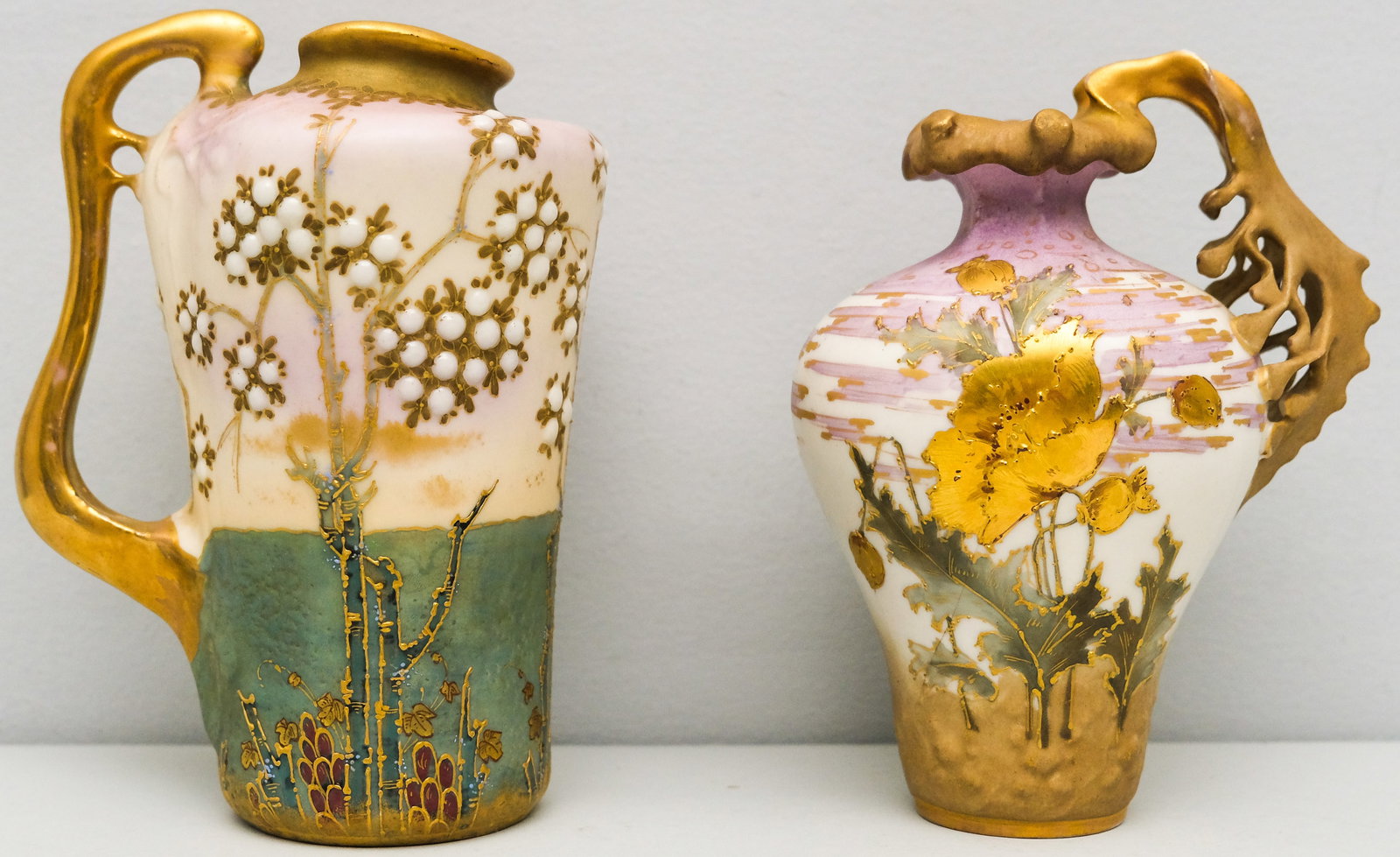 Two Turn Teplitz Art Nouveau Ewers, Jeweled &: The first a ewer depicting branches with "jewel" fruit, the other with gold encrustations. 7 1/2" and 7"