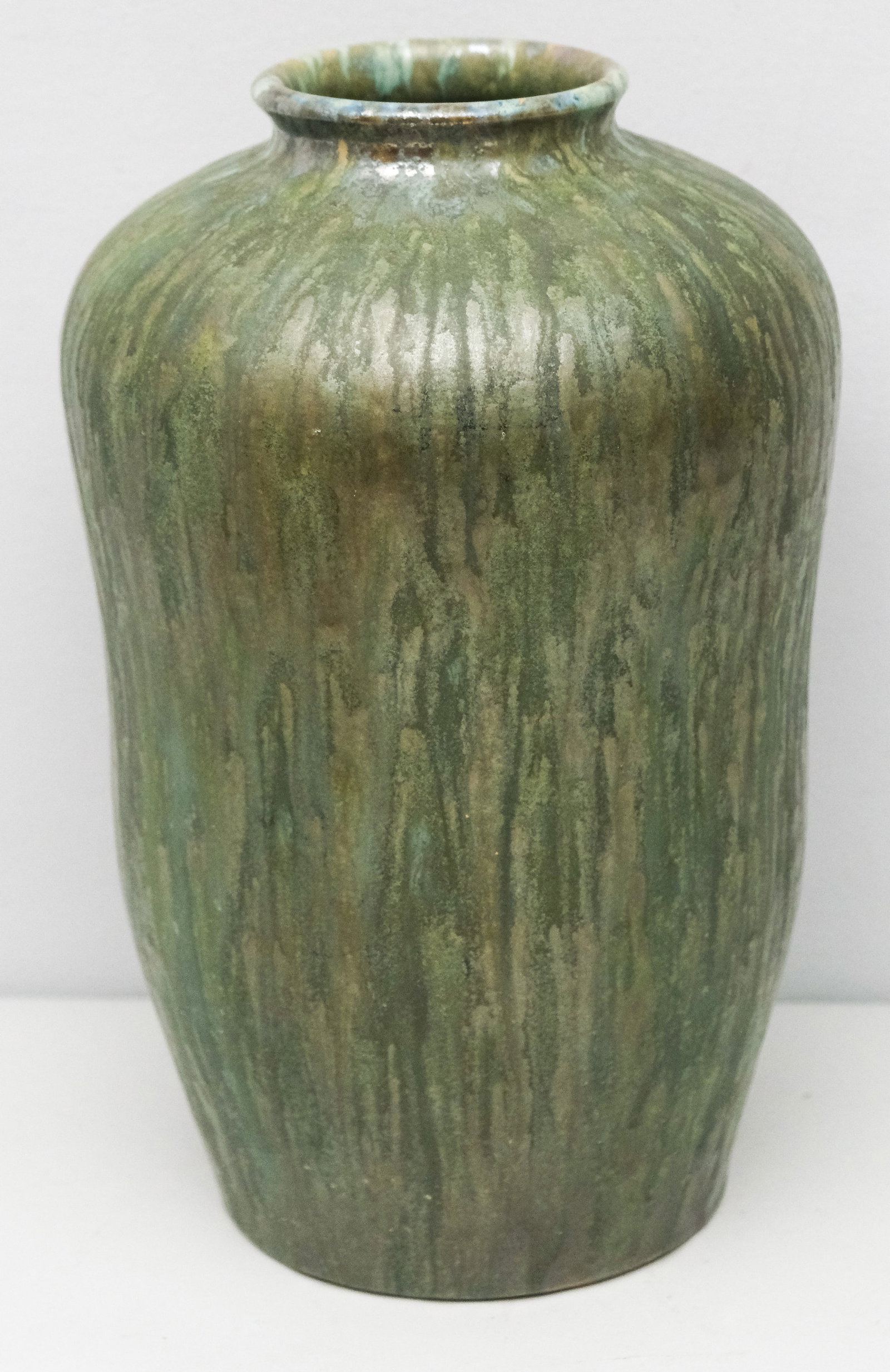 Villeroy Boch Arts & Crafts Pottery Vase: Large body with vertically streaked iridescent semi-matte crystalline glaze. Undulating sides and narrow neck. 12 1/2".