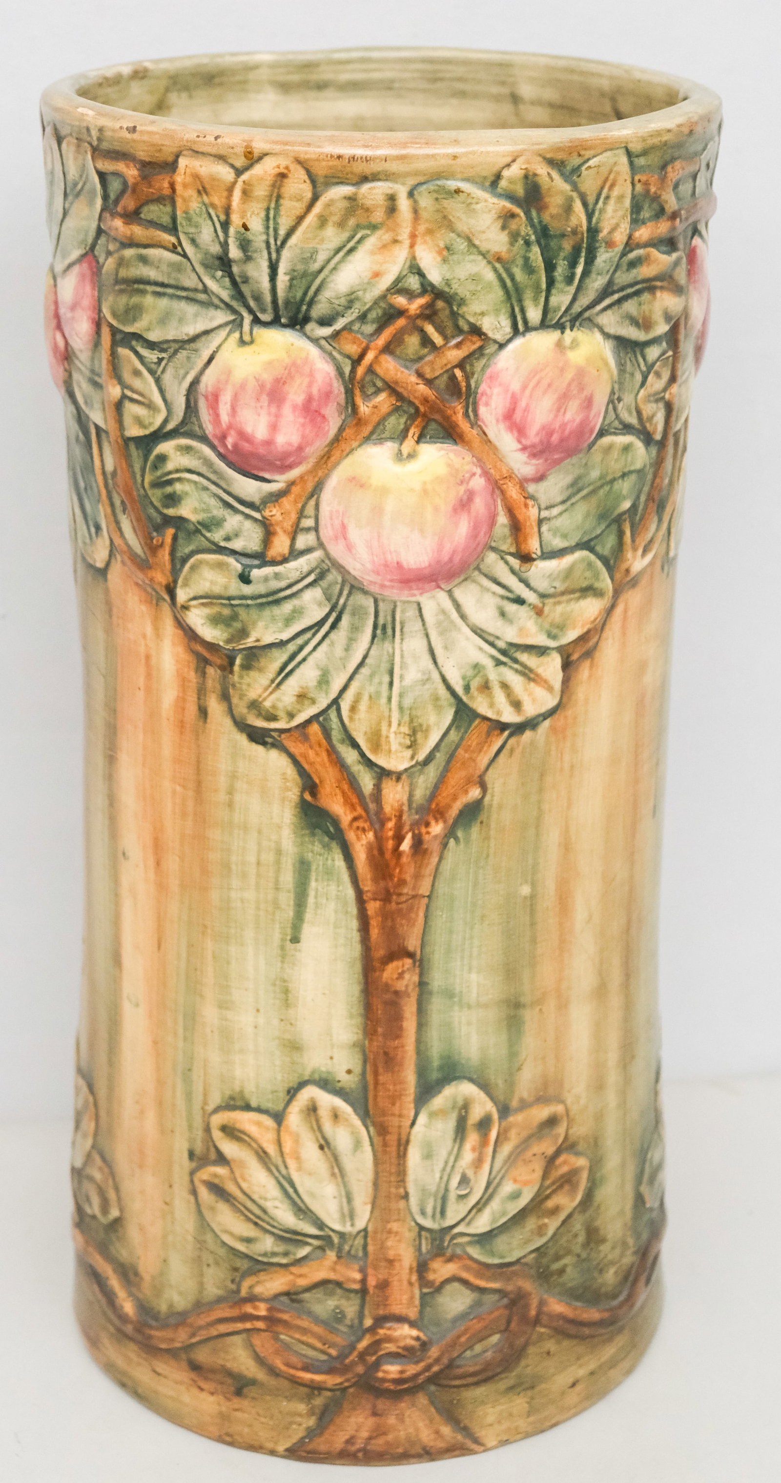 Weller Art Pottery Baldin Apple Umbrella Stand: Mottled naturalistic shades with raised apple tree decor. 22 1/2".