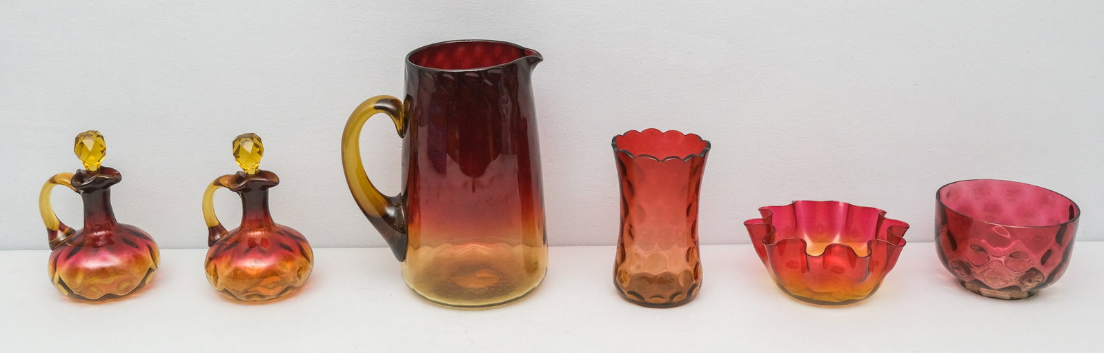 Group of Antique Amberina Glass: Various forms and makers.Measuring from 2 1/2" to 8 1/4"
