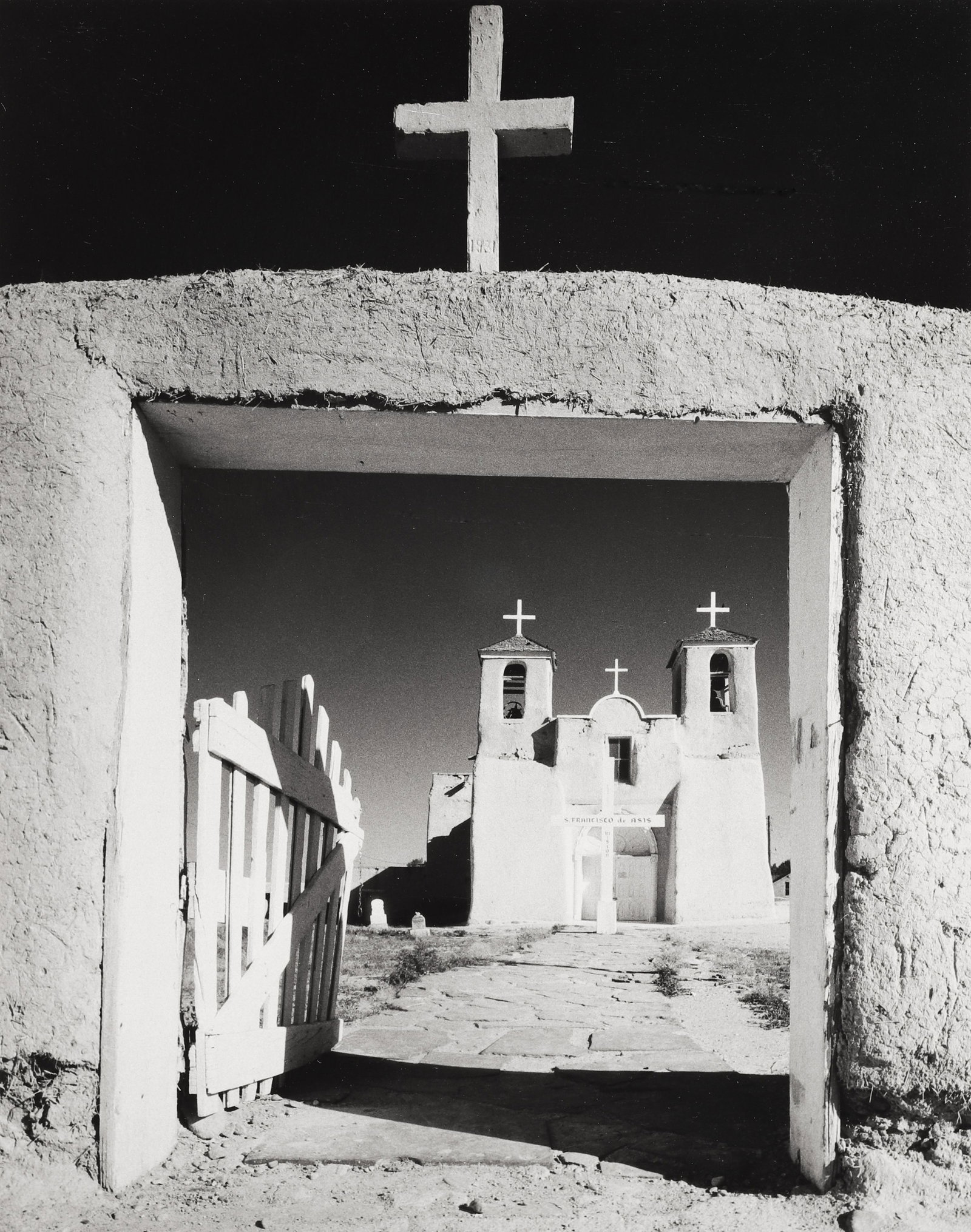 HENRY GILPIN - Church, Ranchos de Taos, NM, c. 1980: A wonderfully composed image of a famous subject. This print is signed in pencil mount recto and bears the portfolio label, title, editioned "4/20", copyright "1986" mount verso. Printed in 1986. Mate