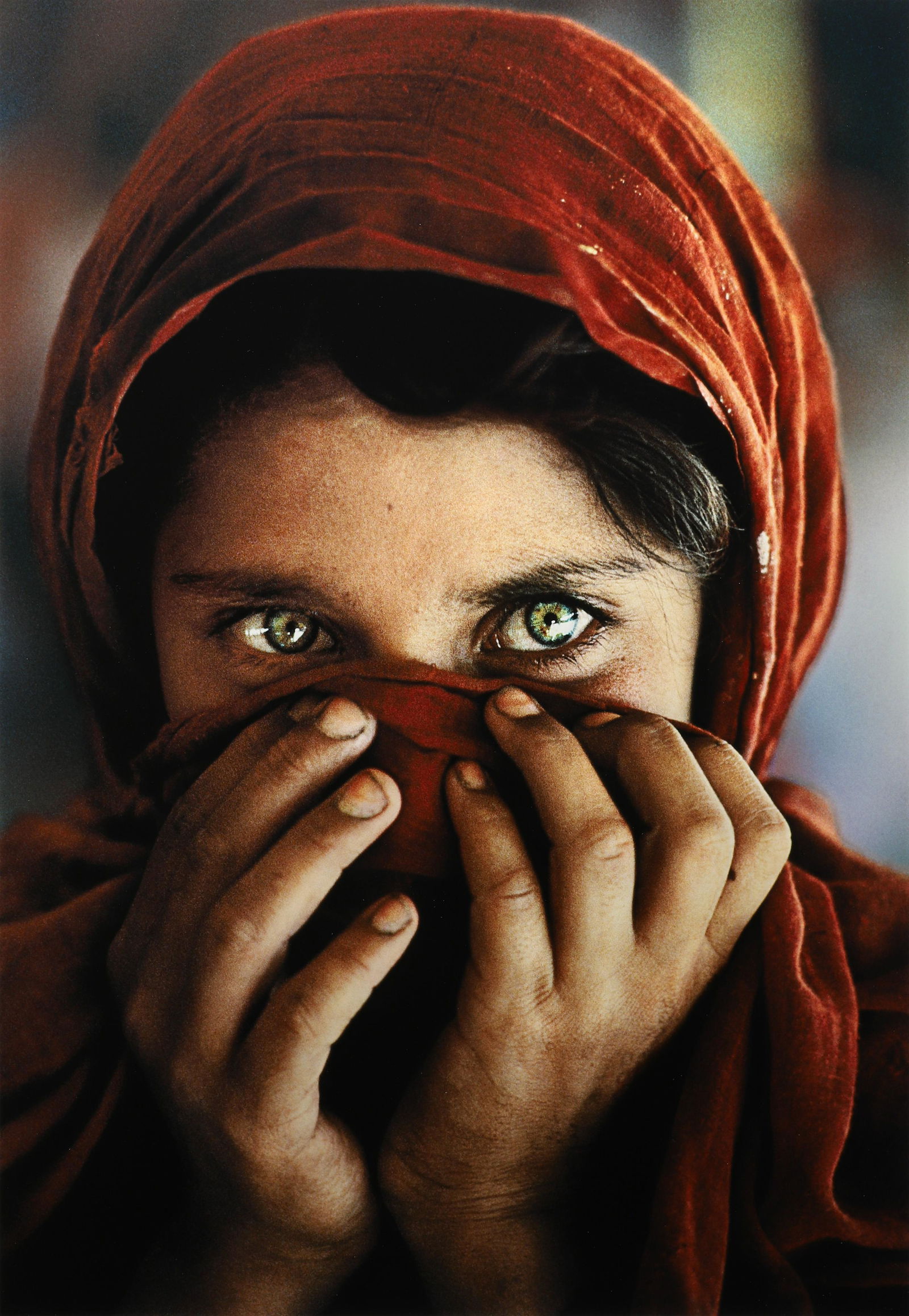 STEVE MCCURRY - Afghan Girl Hiding Face, 1984: This variant of the iconic "Afghan Girl" by Steve McCurry was printed in 2018 in an edition of 90. Signed, numbered and dated in ink verso. Materials & Techniques: Fujicolor Crystal Archive