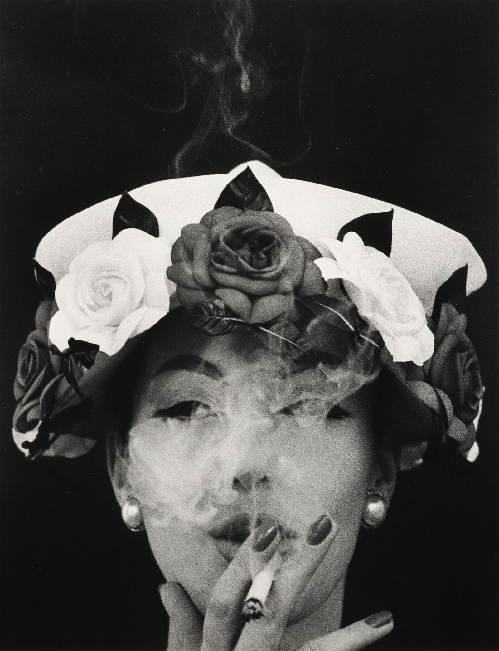 WILLIAM KLEIN - Hat and Five Roses, Paris, 1956: This print, likely made in the 1990s, is on a 16x20 sheet that is signed, titled, and dated in pencil verso. Materials & Techniques: Silver Gelatin