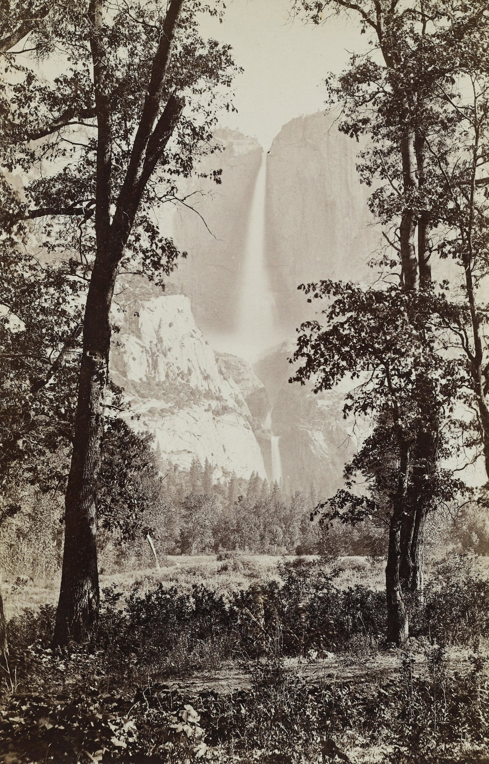 CARLETON WATKINS - Yosemite Falls from Below, 1878-81: This New Series boudoir card is titled in typeset ink with number and credit "Watkins" New Boudoir series Yo Semite and Pacific Coast..." mount recto. Materials & Techniques: Albumen Silver