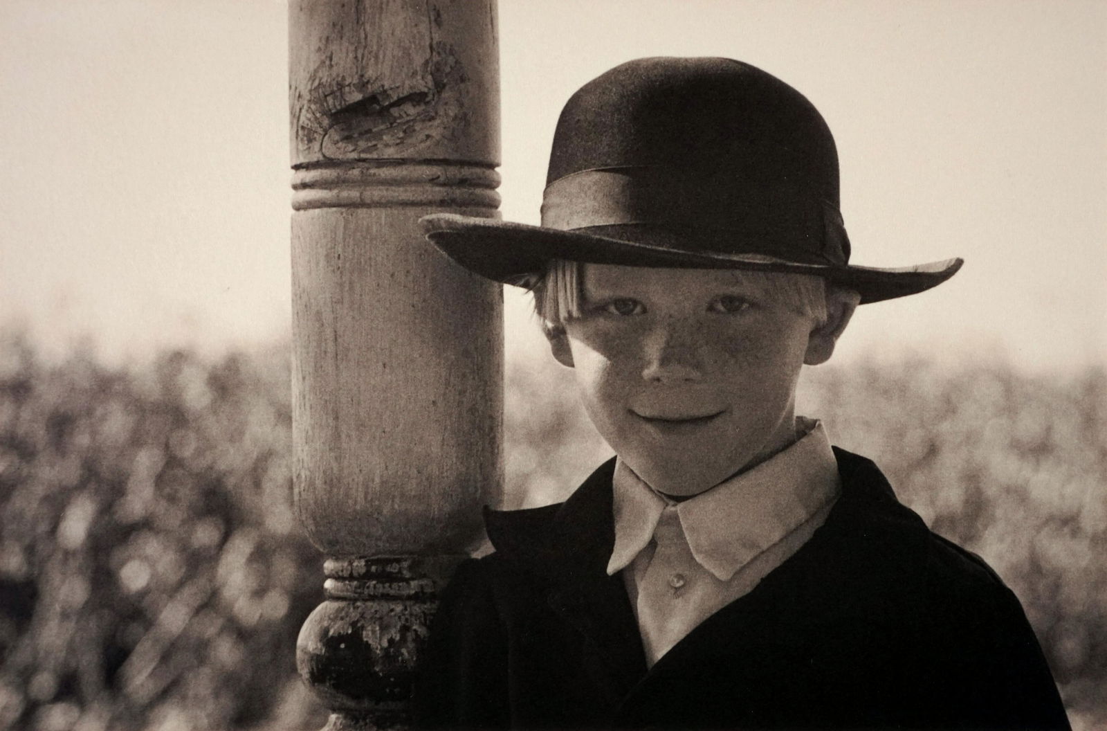 GEORGE TICE - Amish Boy Leaning on Post, Lancaster,: ARTIST: GEORGE TICE TITLE: "Amish Boy Leaning on Post, Lancaster, Pennsylvania, 1968" MEDIUM: Mounted palladium print. Printed 2000. SIZE: Image - 5" x 7 5/8", Mount - 11" x 14", Mat - 14" x 17" DES