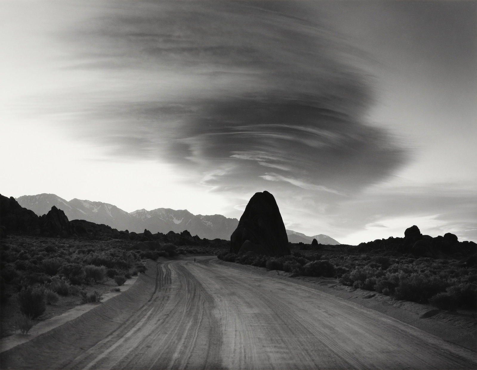 ALAN ROSS - Triangle Rock, Evening Clouds, Alabama: ARTIST: ALAN ROSS TITLE: "Triangle Rock, Evening Clouds, Alabama Hills, CA, 1984" MEDIUM: Silver gelatin print, unmounted. Likely printed 1980s. SIZE: Image - 9" x 11 3/4", Sheet - 11" x 14", Mat - 16