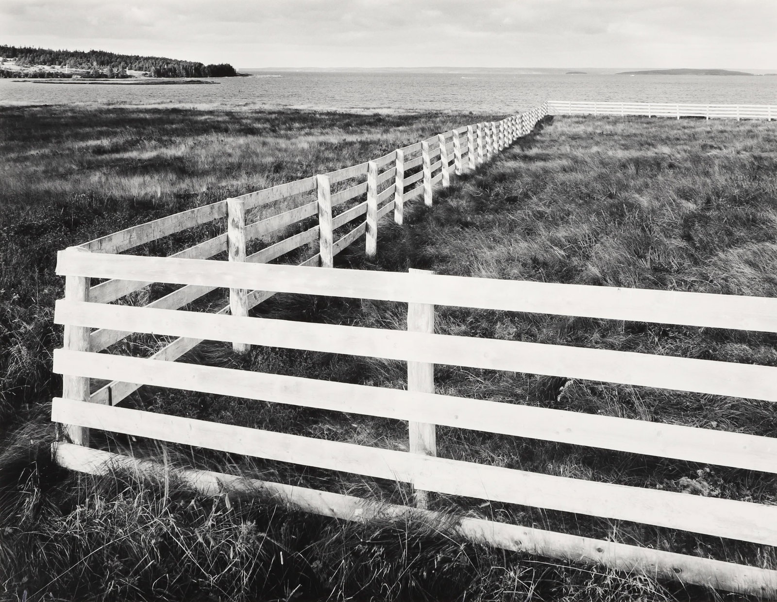 FRED SCHEEL - White Fence, Cape Bruton, Nova Scotia,: ARTIST: Fred Scheel TITLE: White Fence, Cape Bruton, Nova Scotia, Canada, 1980 MEDIUM: Vintage Silver Gelatin IMAGE SIZE: 9 5/8 x 12 3/8 in DESCRIPTION: Signed in pencil mount recto; Message from the 