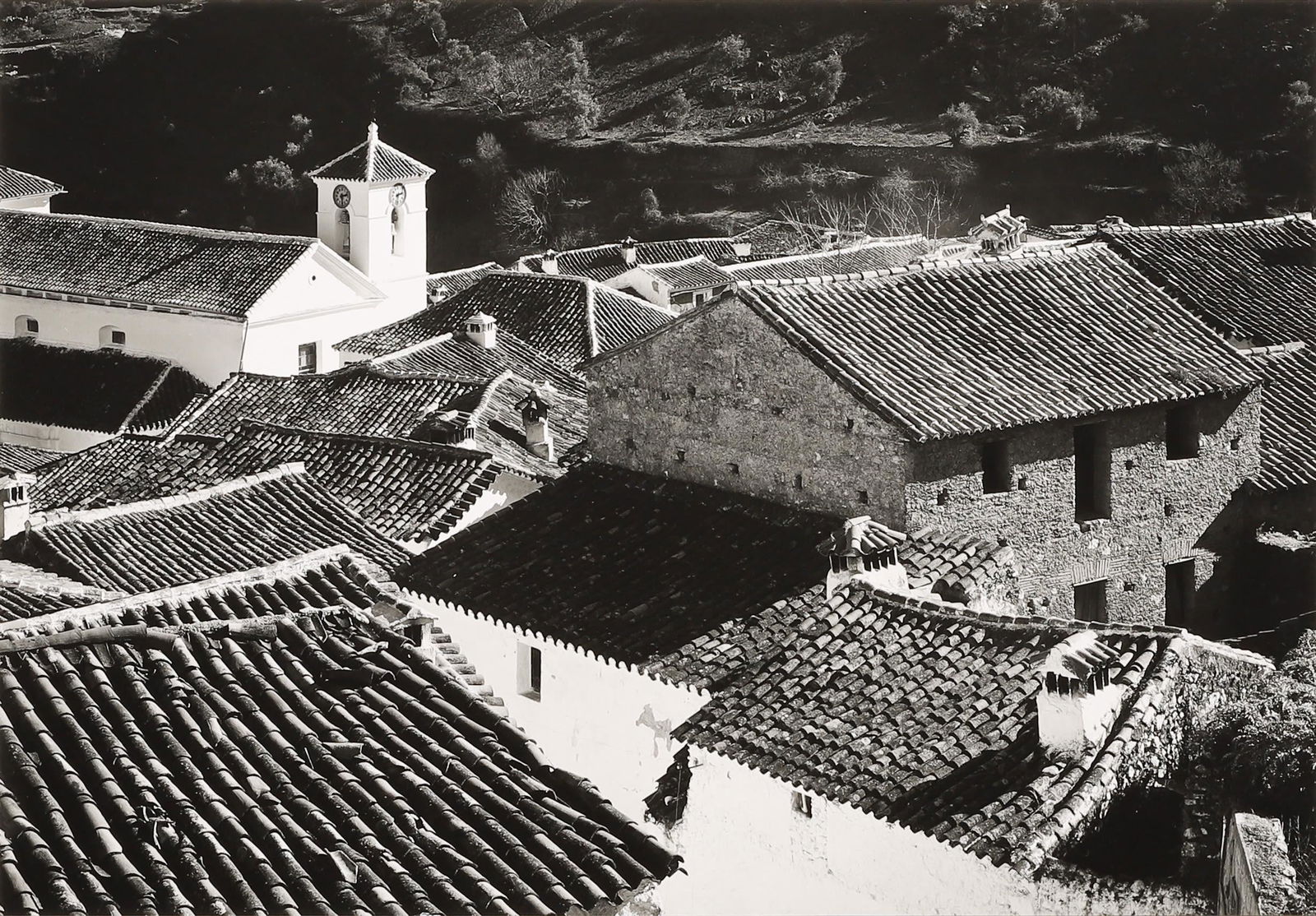 MORLEY BAER - Jubrique, Spain, 1957: ARTIST: Morley Baer TITLE: Jubrique, Spain, 1957 MEDIUM: Silver Gelatin IMAGE SIZE: 6 1/8 x 8 3/4 in DESCRIPTION: This print is signed in pencil mount recto and bears a studio stamp, number, title, an