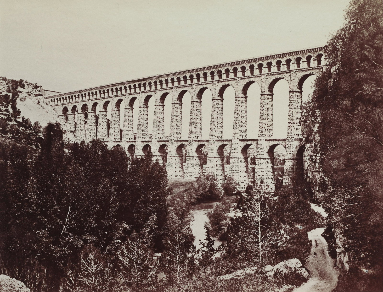 EDOUARD BALDUS - Aqueduct, Roquefavour, 1860: ARTIST: Edouard Baldus TITLE: Aqueduct, Roquefavour, 1860 MEDIUM: Albumen Silver IMAGE SIZE: 7 1/2 x 9 3/4 in DESCRIPTION: A remarkably clean print of one of Edouard Baldus's most recognizable im