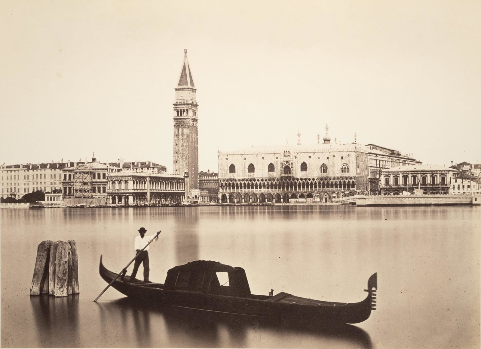 CARLO PONTI - Piazzetta vue de la mer, Gondole Vé: ARTIST: Carlo Ponti TITLE: Piazzetta vue de la mer, Gondole Vénitienne, c. 1865 MEDIUM: Albumen Silver IMAGE SIZE: 10 x 13 7/8 in DESCRIPTION: Blindstamped credit mount recto; typeset title and d