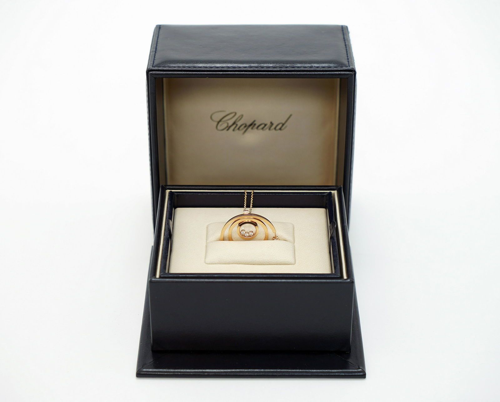 A Lady's Chopard 18K Rose Gold , Happy Diamonds pendant: A Lady's Chopard 18K Rose Gold , Happy Diamonds pendant. 5 Diamonds = 0.24 CT FC 3 Diamonds = 0.17 CT FC Moving Serial Number: 6220677 Total weight: approx: 18 gr. With the original Chopard box and th