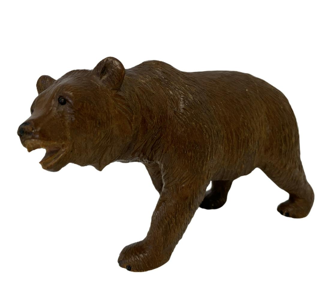 An early 20th century black forest carved wooden bear (1 of 3)