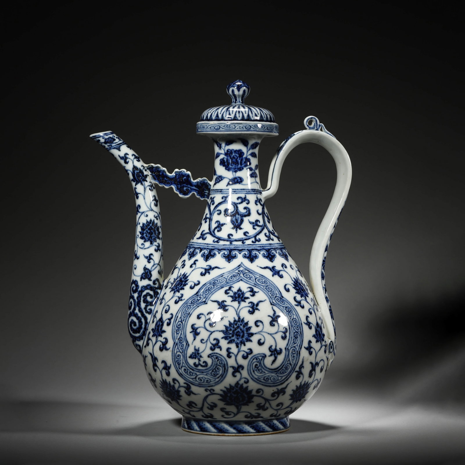 Blue and White Ruyi and Interlocking Lotus Ewer: Name Blue and White Ruyi and Interlocking Lotus Ewer Dimensions Length: 23cm Width: 17cm Height: 31cm Condition Additional photographs and Condition reports are provided by request a