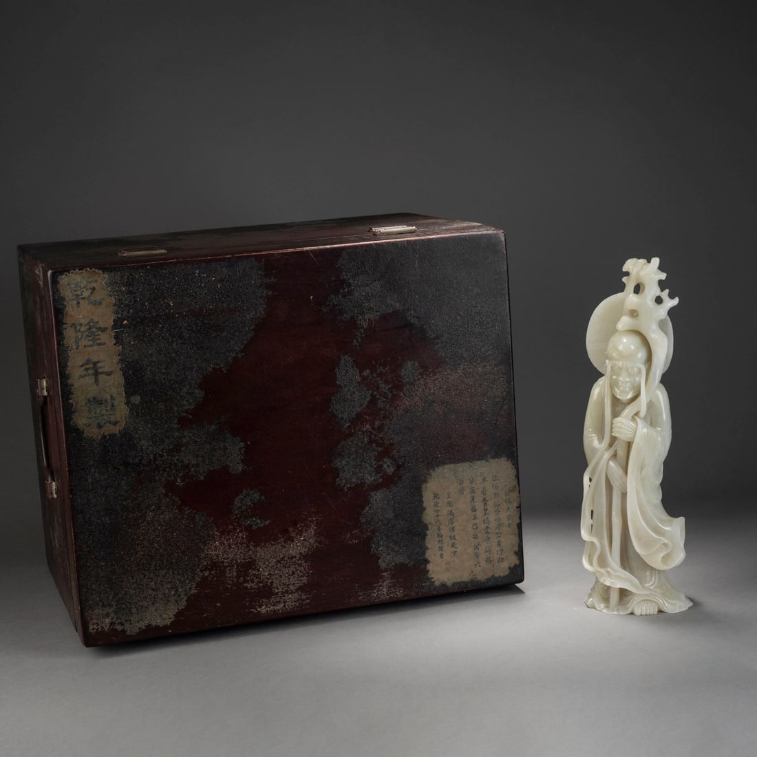 Carved?Jade?Figure?of?Arhat: Name Carved?Jade?Figure?of?Arhat Dimensions Length:10cm Width:6.5cm Height:32.5cm Condition Additional photographs and condition reports are available upon request as a courtesy to our