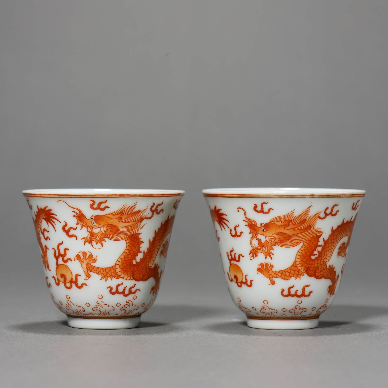 Pair of Iron-Red Glaze Dragon Cups: Name Pair of Iron-Red Glaze Dragon Cups Dimensions Diam.6cm, Height:5cm, ? Condition Additional photographs and condition reports are available upon request as a courtesy to our clients. Any