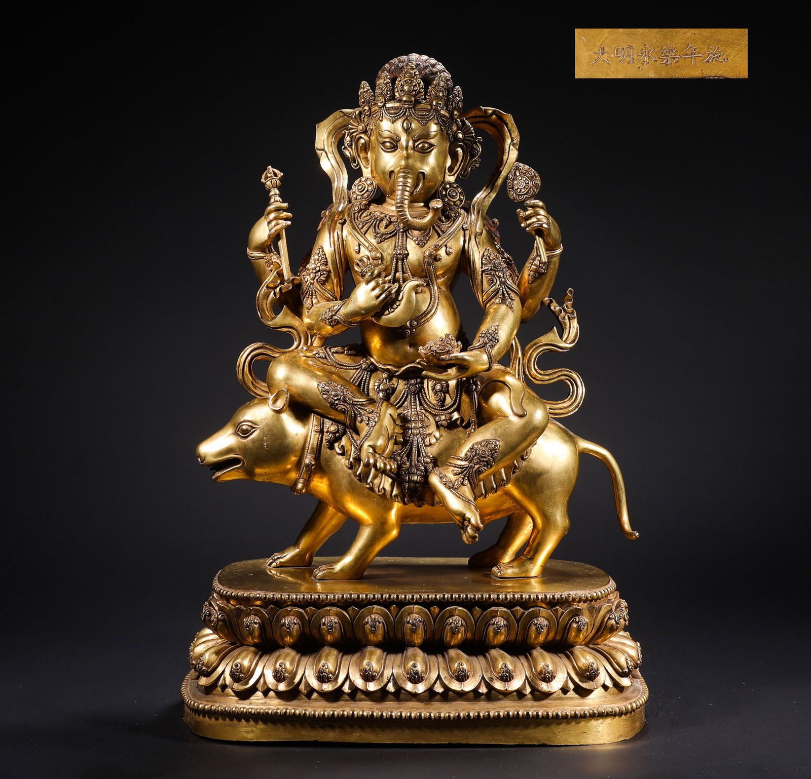 Ming Dynasty Yongle gilded Bronze Elephant Trunk Tiancai Statue: Name Ming Dynasty Yongle gilded Bronze Elephant Trunk Tiancai Statue Dimensions H:55cmW:35cmWeight:20960g Condition Additional photographs and condition reports are available upon request