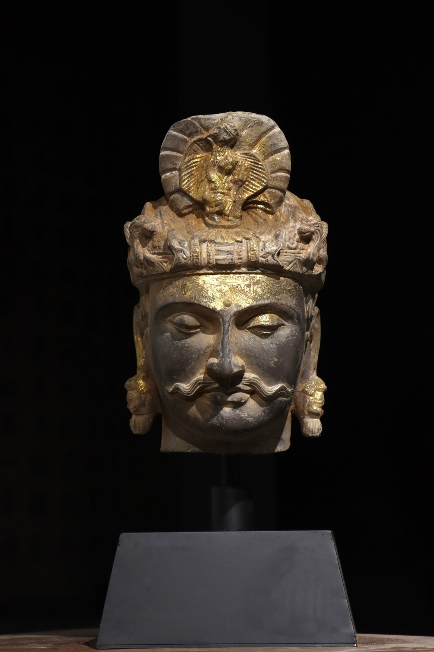 A 4th-century gilded Gandhara Buddha head: Name A 4th-century gilded Gandhara Buddha head Dimensions H:32cm Condition Additional photographs and condition reports are available upon request as a courtesy to our clients. Any c
