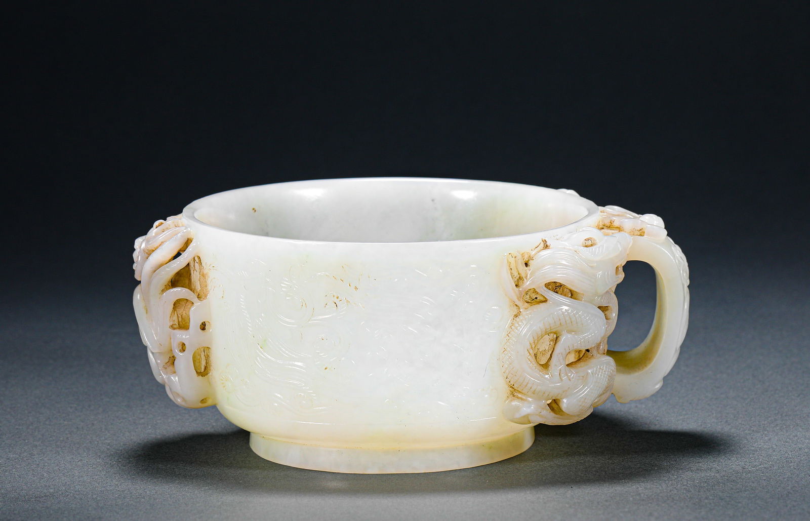 Tang Dynasty Hetian jade Dragon Cup: Name Tang Dynasty Hetian jade Dragon Cup Dimensions H:6.5cmW:14.5cmWeight:450g Condition Additional photographs and condition reports are available upon request as a courtesy to o