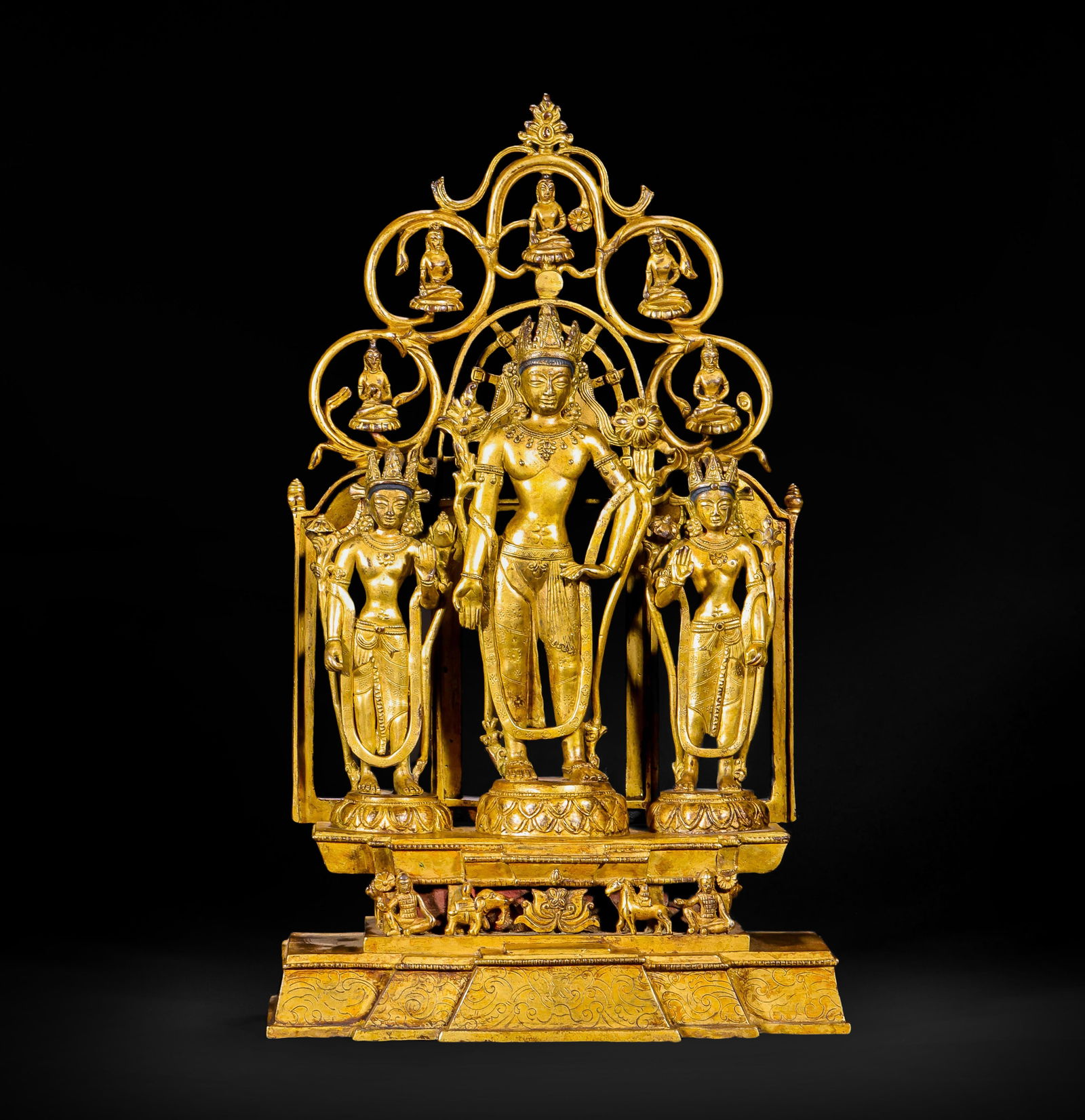 A GILDED BRONZE GROUP OF ONE BUDDHA AND TWO ATTENDANT BODHISATTVAS FROM THE TANG DYNASTY: Name A GILDED BRONZE GROUP OF ONE BUDDHA AND TWO ATTENDANT BODHISATTVAS FROM THE TANG DYNASTY Dimensions H:40cm W:25cm Weight6650g This is a group of gilded copper statues featuring one Buddha and two