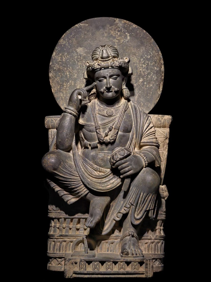 6TH-CENTURY GANDHARA STATUES: Name 6TH-CENTURY GANDHARA STATUES Dimensions H:83cm W:43cmT:30cm This is a grey SLATE thinking Bodhisattva sitting figure in the Gandhara style, presented in a semi-lotus position, with the right hand