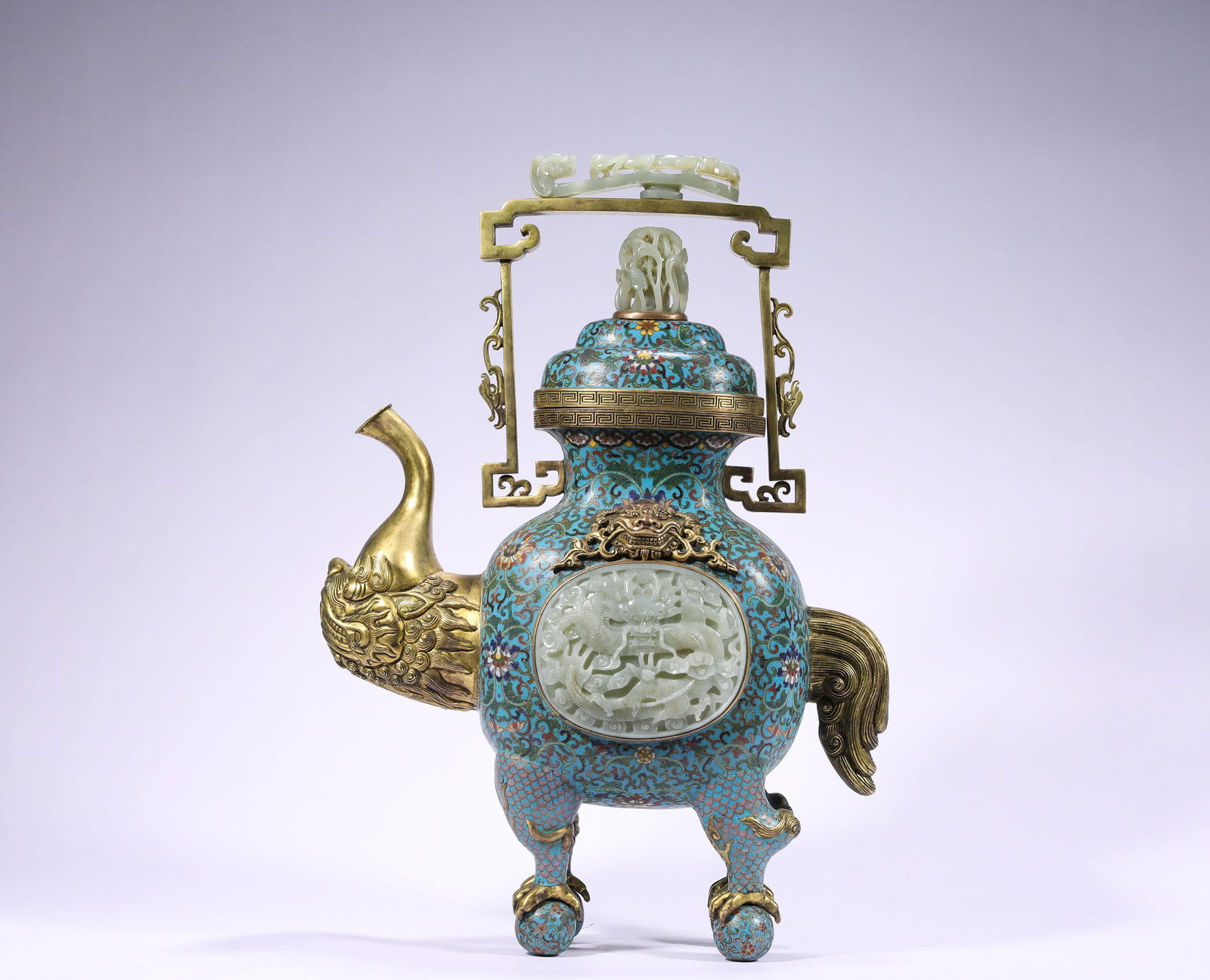 QING DYNASTY, QIANLONG COPPER CLOISONNE INLAID WITH HETIAN JADE FOR APPRECIATION: Name QING DYNASTY, QIANLONG COPPER CLOISONNE INLAID WITH HETIAN JADE FOR APPRECIATION Dimensions H:44cm W:30cm Weight:4710g This is a cloisonne enamel teapot with a white jade dragon pattern inlaid in