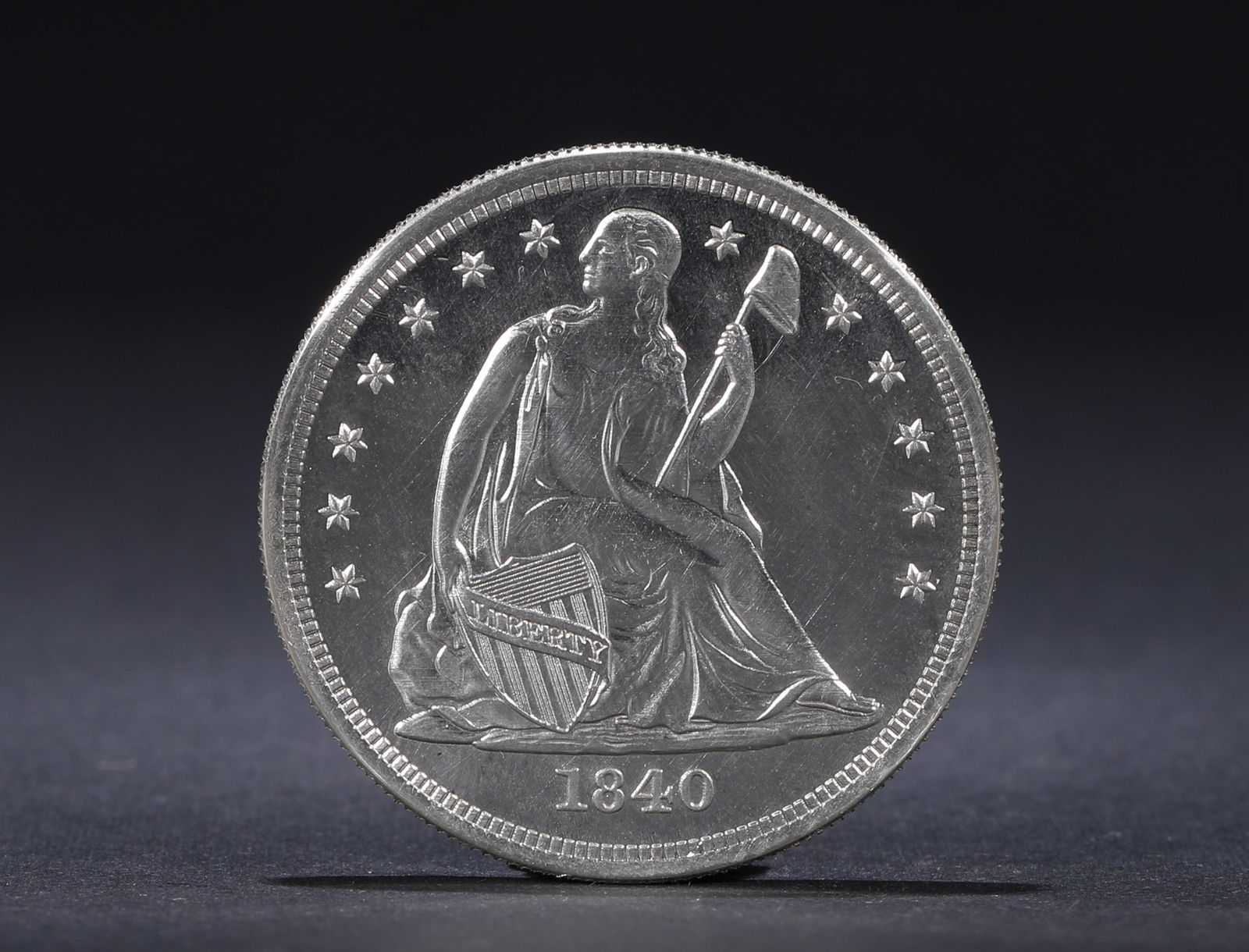 A SILVER COIN OF THE STATUE OF LIBERTY IN 1840, USA: Name A SILVER COIN OF THE STATUE OF LIBERTY IN 1840, USA Dimensions D:3.7cm Weight:27g Condition Additional photographs and condition reports are available upon request as a courte