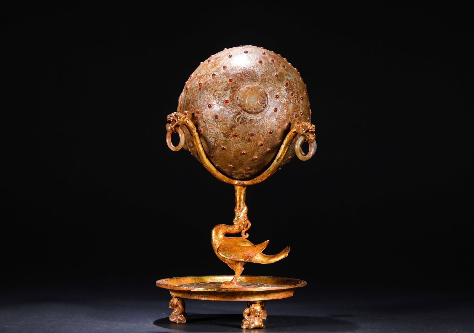 BRONZE GILDED STAR CHART OF THE HAN DYNASTY: Name BRONZE GILDED STAR CHART OF THE HAN DYNASTY Dimensions H:28cm W:20cm Weight:2500g The main body is an ancient jade ball inlaid with red jewels, with star patterns and divine beast patterns engrav