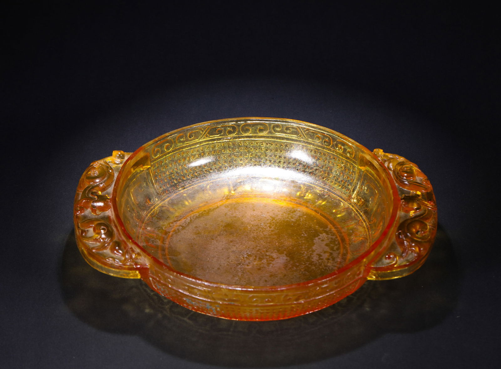 A GLASS WINE CUP OF THE HAN DYNASTY: Name A GLASS WINE CUP OF THE HAN DYNASTY Dimensions H:4cm W:23.5cm Weight:1030g Condition Additional photographs and condition reports are available upon request as a courtesy to