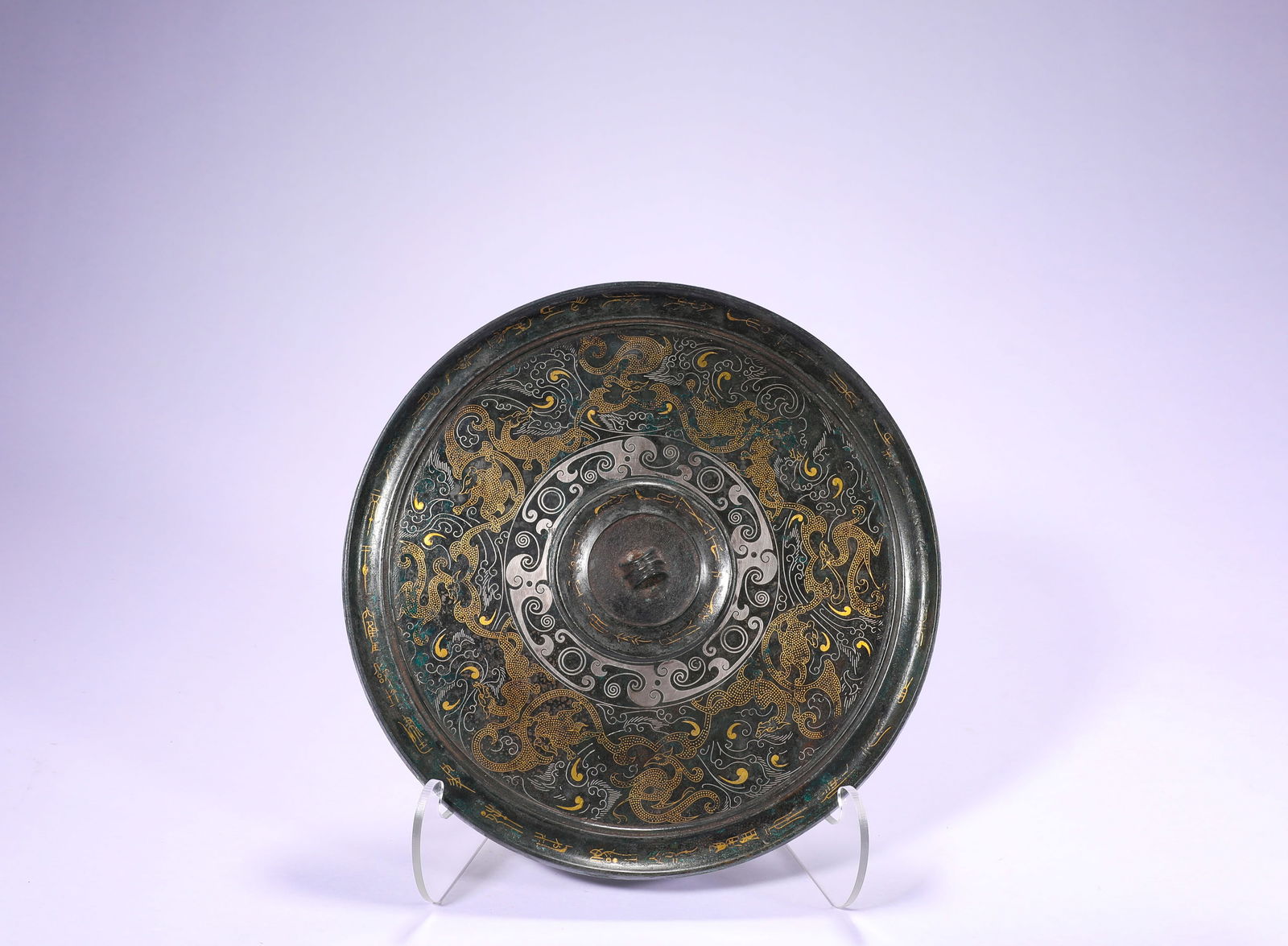 BRONZE CHISELED GOLD AND SILVER DRAGON INSCRIPTION MIRROR OF THE HAN DYNASTY: Name BRONZE CHISELED GOLD AND SILVER DRAGON INSCRIPTION MIRROR OF THE HAN DYNASTY Dimensions D:19.3cm Weight:680g Condition Additional photographs and condition reports are availab