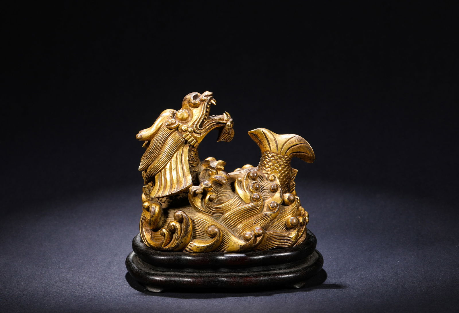 BRONZE GILDED FISH-DRAGON FIGURINE FROM THE QING DYNASTY: Name BRONZE GILDED FISH-DRAGON FIGURINE FROM THE QING DYNASTY Dimensions H:8.5cm W:9.5cm Weight:1420g Condition Additional photographs and condition reports are available upon req