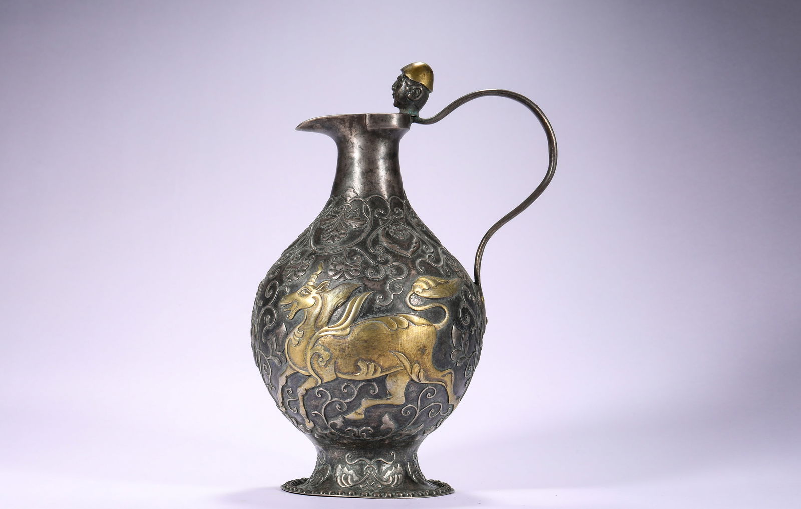 A 5TH CENTURY GILDED SILVER TEAPOT WITH AUSPICIOUS BEAST PATTERNS: Name A 5TH CENTURY GILDED SILVER TEAPOT WITH AUSPICIOUS BEAST PATTERNS Dimensions H:24cm W:15.5cm Weight:610g Condition Additional photographs and condition reports are available