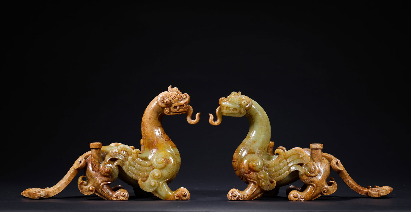 HAN DYNASTY, A PAIR OF AUSPICIOUS BEASTS MADE OF HETIAN JADE: Name HAN DYNASTY, A PAIR OF AUSPICIOUS BEASTS MADE OF HETIAN JADE Dimensions H:14.5cm W:25cm Weight:2430g Condition Additional photographs and condition reports are available upon
