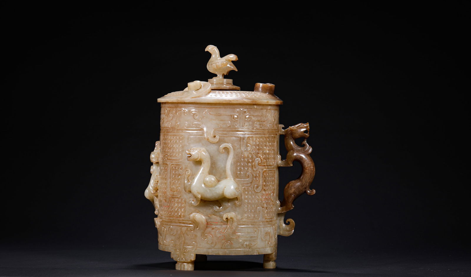 HAN DYNASTY, HETIAN JADE RITUAL VESSEL COVERED CUP: Name HAN DYNASTY, HETIAN JADE RITUAL VESSEL COVERED CUP Dimensions H:26cm W:18cm Weight:1650g Condition Additional photographs and condition reports are available upon request as