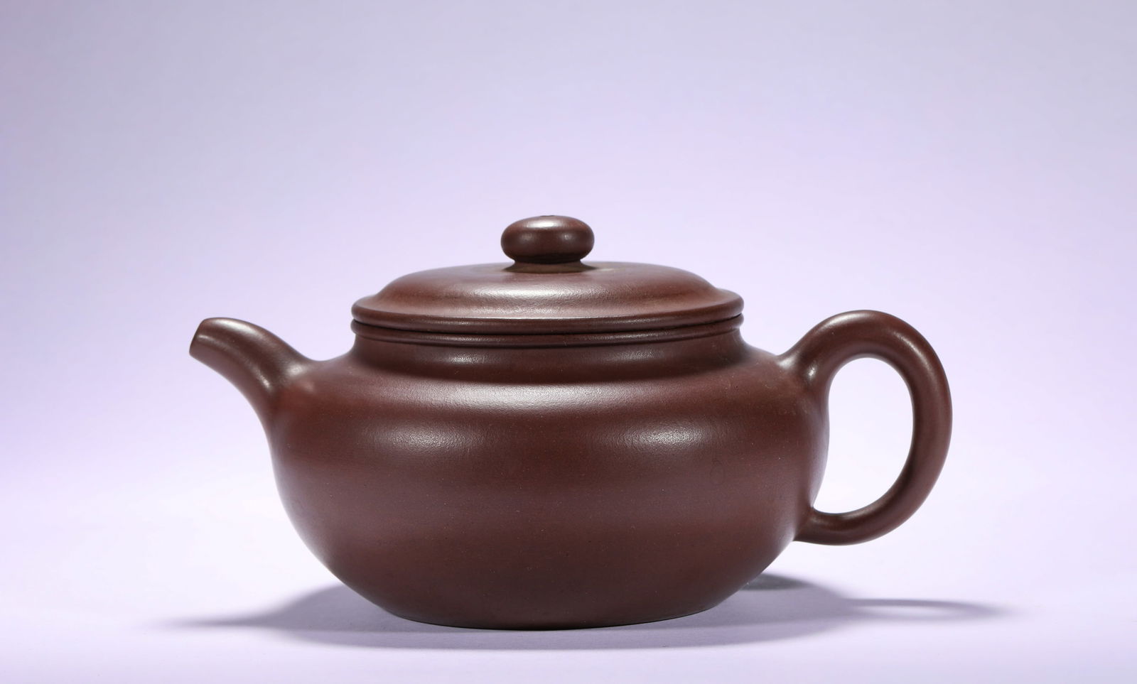 QING DYNASTY, SHAO DAHENG PURPLE CLAY TEAPOT: Name QING DYNASTY, SHAO DAHENG PURPLE CLAY TEAPOT Dimensions H:10cm W:17.5cm Condition Additional photographs and condition reports are available upon request as a courtesy to our