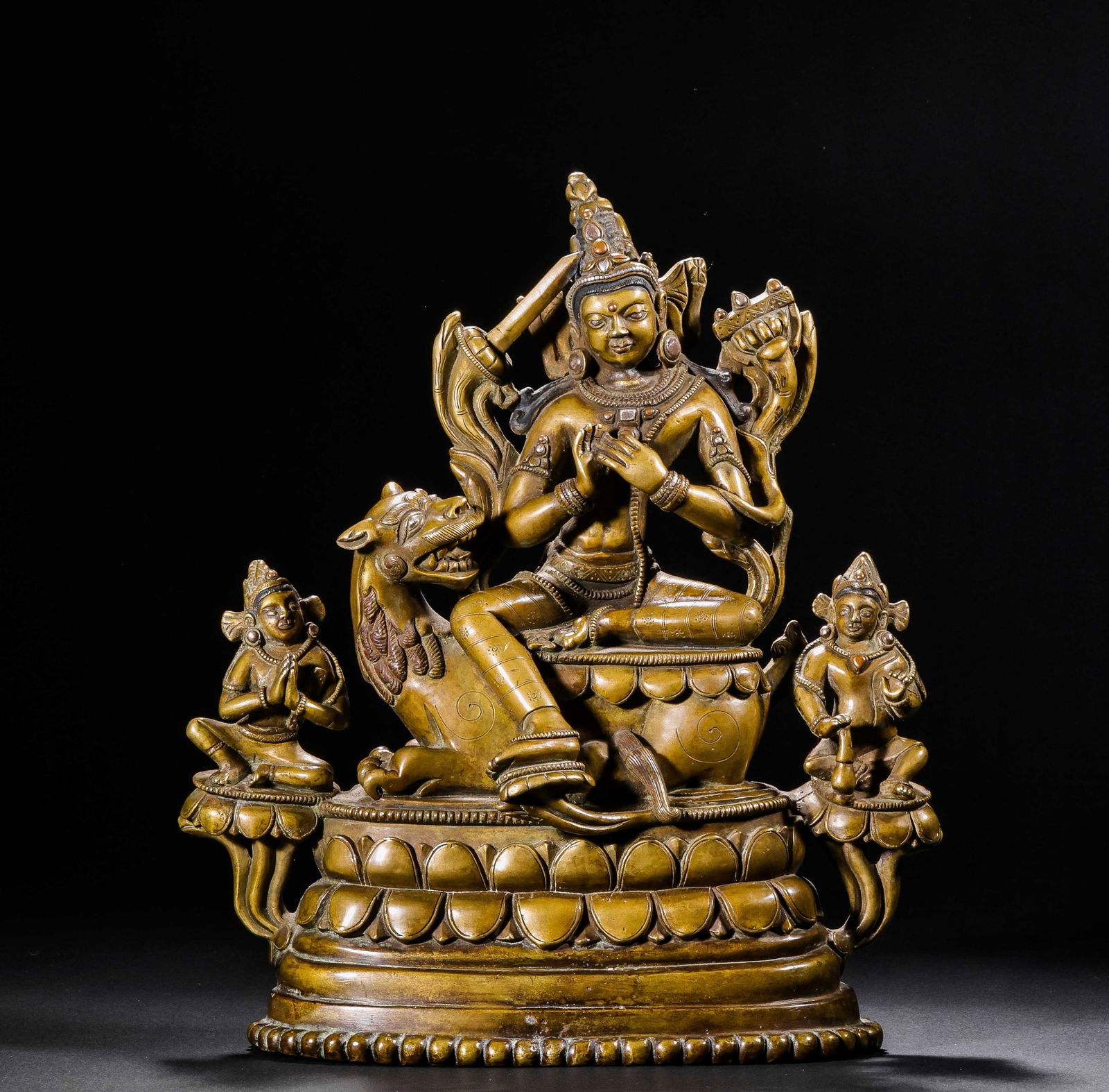 A 17TH-CENTURY ALLOY COPPER STATUE OF MANJUSRI BODHISATTVA SITTING WITH THE DONOR (1 of 17)