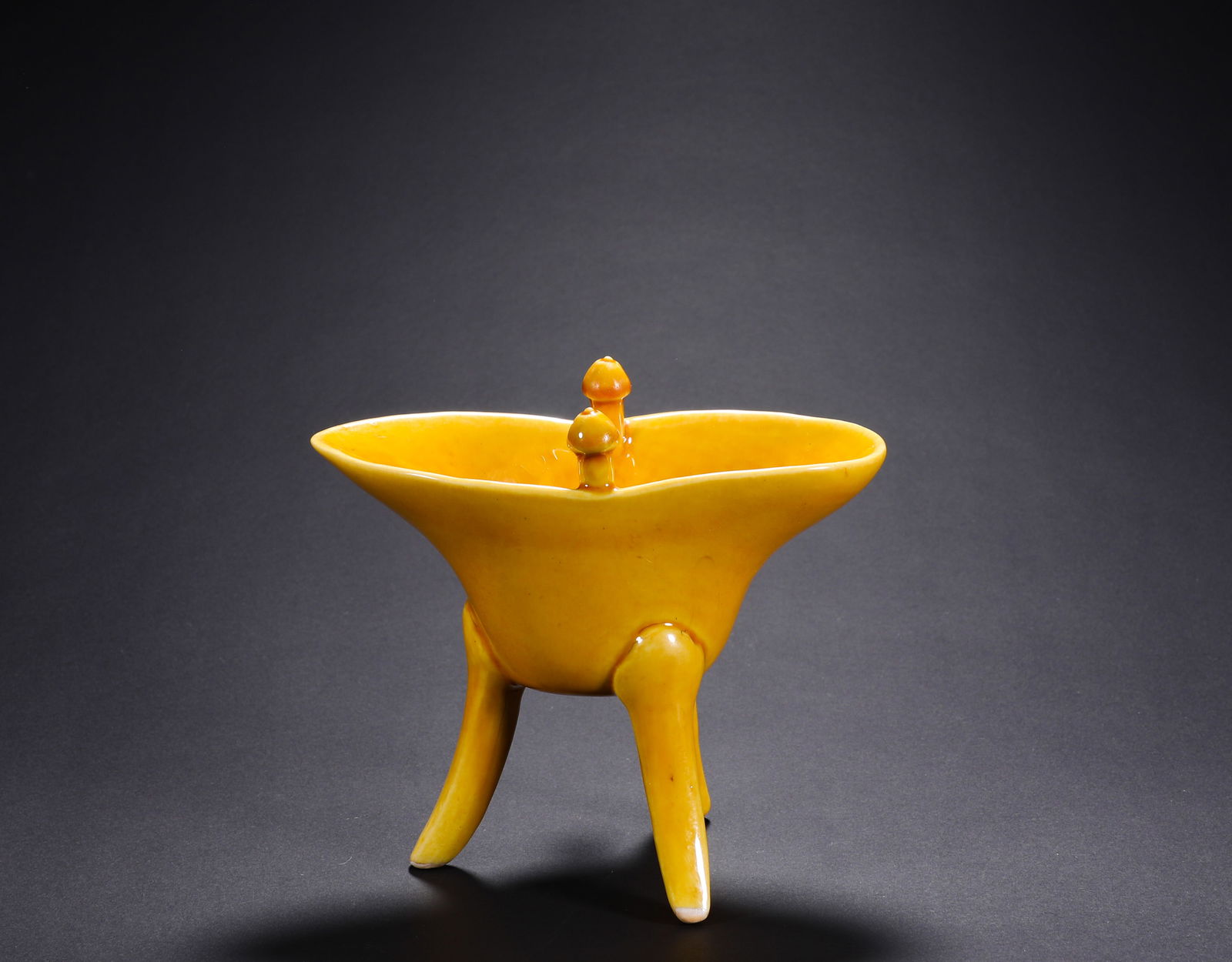 MING DYNASTY, JIAJING YELLOW GLAZED THREE-LEGGED WINE CUP: Name MING DYNASTY, JIAJING YELLOW GLAZED THREE-LEGGED WINE CUP Dimensions H:11cm W:12cm Condition Additional photographs and condition reports are available upon request as a courte