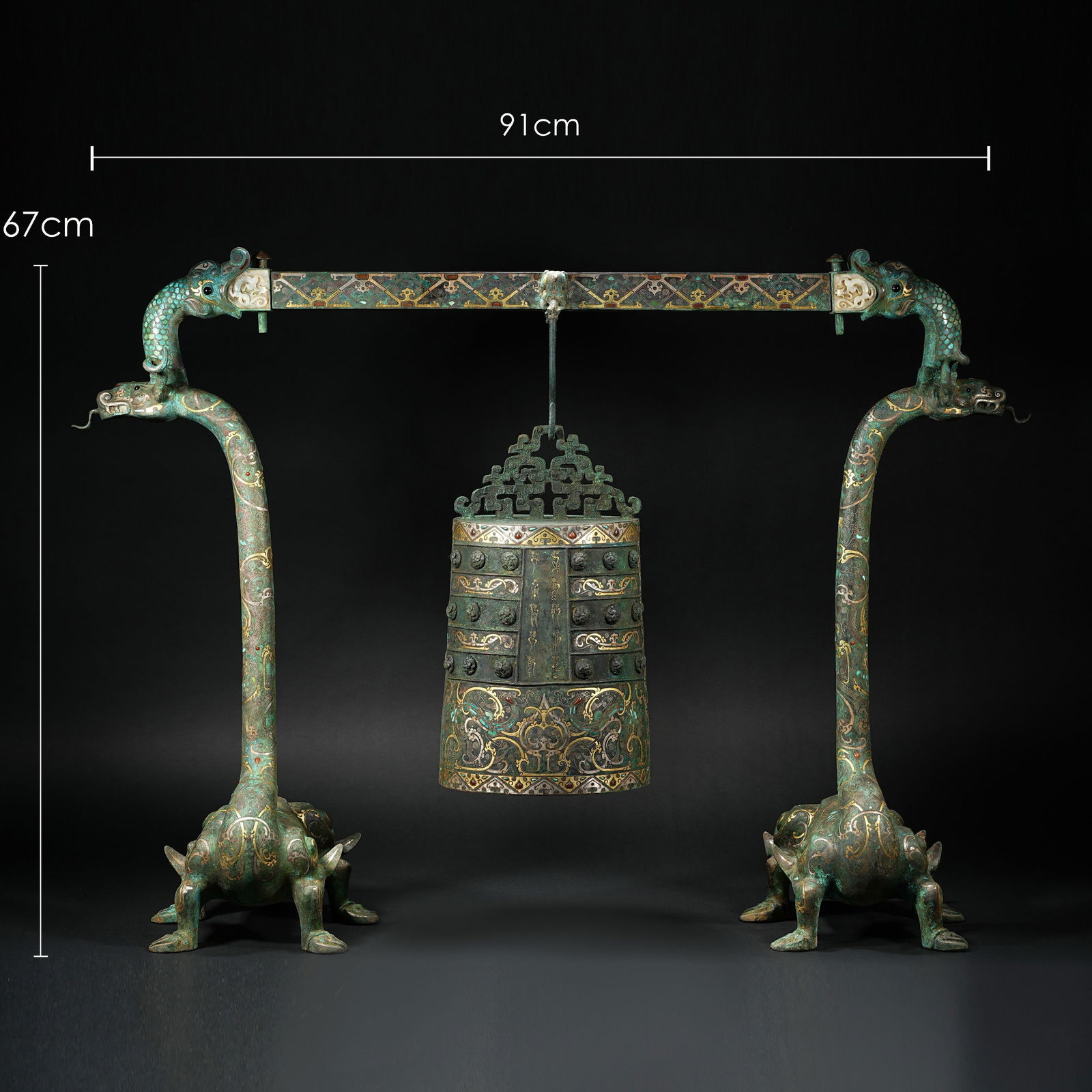 BRONZE PERCUSSION INSTRUMENT WITH GOLD AND SILVER INSCRIPTIONS FROM THE HAN DYNASTY, BEAST-SHAPED: Name BRONZE PERCUSSION INSTRUMENT WITH GOLD AND SILVER INSCRIPTIONS FROM THE HAN DYNASTY, BEAST-SHAPED BELL STAND Dimensions H: 67 CM; W: 91 CMTHIS IS A SET OF BRONZE BO BELL WITH GOLD AND SILVER INLA